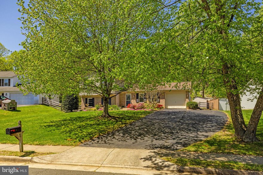 Leesburg Country Club neighborhood (no HOA)!!  Beautifully maintained single-family home, ideally located on a quiet cul-de-sac with low traffic.  ****   Inside, the home is in excellent, move-in ready condition with thoughtful updates throughout. The kitchen features Corian & granite countertops, a center island, stainless steel appliances, & bright, sunny windows.  The main level and lower-level family room offer durable & beautiful LVP flooring, while the bedrooms are carpeted. The walkout lower level opens directly to a beautiful slate patio, creating seamless indoor-outdoor flow and additional space for gatherings.  There's also a large 4th bedroom and full bath on the lower level!  ****  Private, fully fenced backyard backing to a scenic hillside (zero water runoff issues!) and mature trees, creating a peaceful, natural setting perfect for relaxing outdoors and entertaining.  Lovely landscaping with mature flowering trees throughout the seasons. **** At the end of the cul-de-sac is easy access to Westpark, a county-owned passive park in conservation easement, with 134 acres of walking trails and nature areas—ideal for walking, jogging, dog walking,  & birdwatching.  **** All of this is just a 5-minute drive to Historic Downtown Leesburg, known for its restaurants, shops, events, and charm. This home offers a rare combination of comfort, privacy, mature landscaping, and convenient access to parks,  great schools, & historic downtown Leesburg.   It's only a 4-minute drive to Route 7 and the Greenway for easy commuting **** Additional features include a backyard shed, extra storage above the garage, an attached garage, and extensive driveway parking, providing plenty of room for multiple vehicles and guests. **** Enjoy the benefits of public utilities and town services, including road and sidewalk maintenance, trash service, leaf pickup, & snow removal—all without restrictions of an HOA. **** This home offers an exceptional combination of location, condition, outdoor space, and lifestyle, making it a standout opportunity in Leesburg!