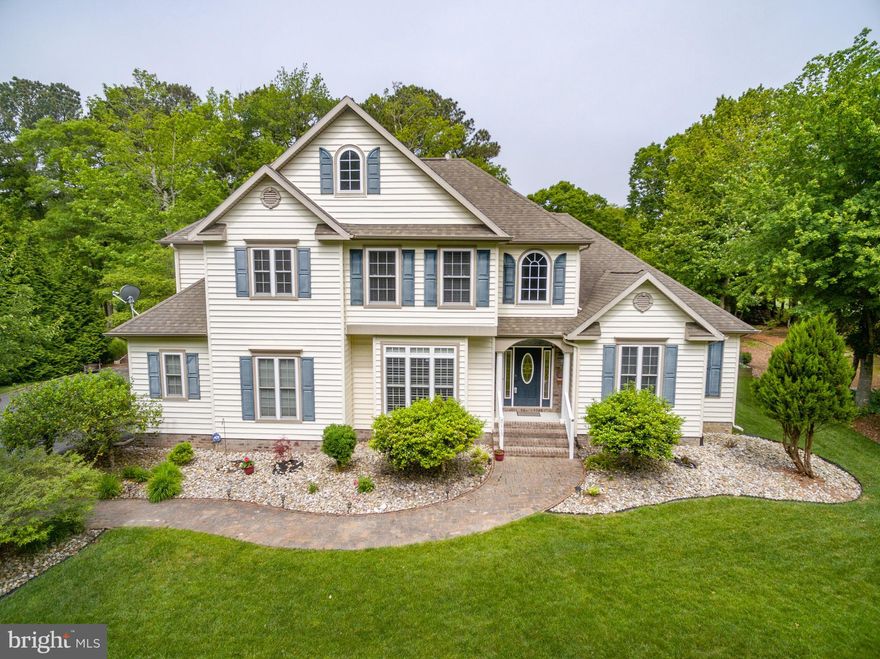 Look no further.  NO HOA Fees..  This beautiful home is nestled on a 3/4 acre lot  overlooking the 6th fairway of the Ocean City Golf Club.  The versatile open floor plan offers a spacious kitchen and breakfast nook with an amazing view.  Dining room with custom barn doors.  Large family room that features a stone  fireplace and lots of natural light.  Living room with cathedral ceilings and additional fireplace.   First floor luxury master suite with whirlpool tub and walk in closets.  Second floor includes loft, two additional bedrooms with full bath and fourth bedroom with half bath (could be used as an additional master ).  Hardwood, tile flooring and track lighting are just a few of the many "extras" this home offers.   This home is perfect for entertaining  or enjoying a "peaceful" evening on your upgraded deck that offers a built in exercise pool.  Large driveway, two car garage and mature landscaping.  Captivating views inside and out.  Minutes from Assateague  beach and boat ramps.