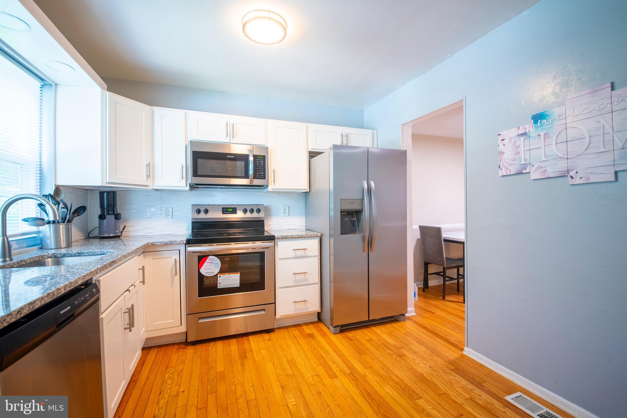 **OPEN HOUSE SUNDAY AUGUST 31ST 2-4 OCLOCK** Welcome to this Beautiful home featuring a Gorgeous Sunlit Kitchen w/ Stainless Steel appliances, Quartz countertops, Lovely wood flooring. The spacious living room is filled with natural sunlight, creating a warm and inviting atmosphere. Upper level offers 3 generous sized bedrooms, full bath with ceramic tile bath/shower. The large finished lower level includes a cozy/ warm fireplace for those days when entailing is a must to stay inside! Patio doors leading outside to backyard, a generous size laundry room and space for a workshop along the wall. Replacement windows through and a convent 1/2 bath on the main level. This is truly a Wonderful home with plenty of space inside and out. Your Buyer will love this one!!