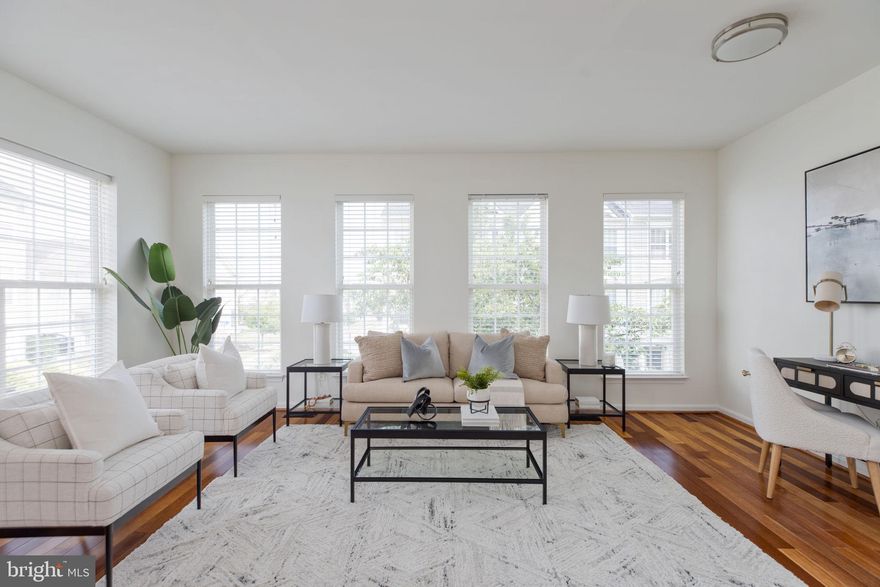 Simply stunning end unit townhome loaded with natural light in the sought-after Ashburn Village community! Offering 3 BR | 2 BA | 2 HBA with 2-car garage parking and sited just steps from green spaces and the WO&D trail - this home has it all. The MAIN LEVEL features a lovely eat-in kitchen with stainless steel appliances, updated sink and faucet, recessed lighting, plus an adjoining breakfast room with a fireplace and glass doors leading to the generously sized deck! The living room is expansive with plenty of room for entertaining and everyday space, and the powder room is conveniently located on this level. On the UPPER LEVEL, this ideal floor plan offers the primary room with a large walk in closet, en suite bathroom with a shower, jetted tub, and large vanity, along with two additional bedrooms and a second full bathroom. 
The LOWER LEVEL includes the bonus room or den - providing a wonderful opportunity for flexible space, and the laundry room with newer units, closet/storage space, powder room, two car garage, and new HVAC system are also on this level. Enjoy the front green space with its cherry blossom tree, mature landscaping, and a charming community with sidewalks, green spaces throughout, quick access to the WO&D trail! This home is so conveniently located close to  Ashburn Village amenities, such as the Sports Pavilion,  as well as the pools, lakes, ponds, and other recreational spaces. This community offers events and gatherings throughout the year, such as seasonal celebrations, concerts, VillageFest, camps and activities, other social events, etc. Ashburn Village also offers easy access to shopping, stores, restaurants, coffee shops, and more. This location is truly exceptional! 

NOTEWORTHY IMPROVEMENTS/UPDATES include the HVAC - 2021, roof - 2021, hot water heater - 2020, all new paint, newer carpets and wood flooring, lighting, fans, and more!