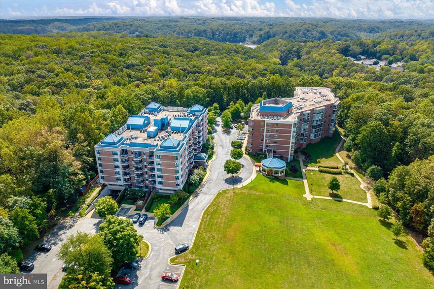 Tucked into the treetops of Heritage Harbour, this updated two-bedroom, two-bath condo offers comfortable, low-maintenance living within one of Annapolis’s established 55+ communities.
The interior has been refreshed with new flooring in the main living areas and fresh paint throughout. The kitchen has been remodeled with updated countertops, and newer appliances. Major systems have also been replaced over the last few years, including the HVAC, water heater, washer, and dryer.  A private balcony provides outdoor space with treetop views. The building includes elevator access, a game room, and indoor and outdoor pools.  Heritage Harbour residents have access to a community lodge with fitness facilities, billiards, a library, and gathering spaces, along with golf, tennis, pickleball, water access, boat storage, an additional community pool, and nearby shopping.  Close by are parks, medical facilities, shopping centers, marinas, dining options, and waterfront attractions, along with access to the greater Annapolis area.