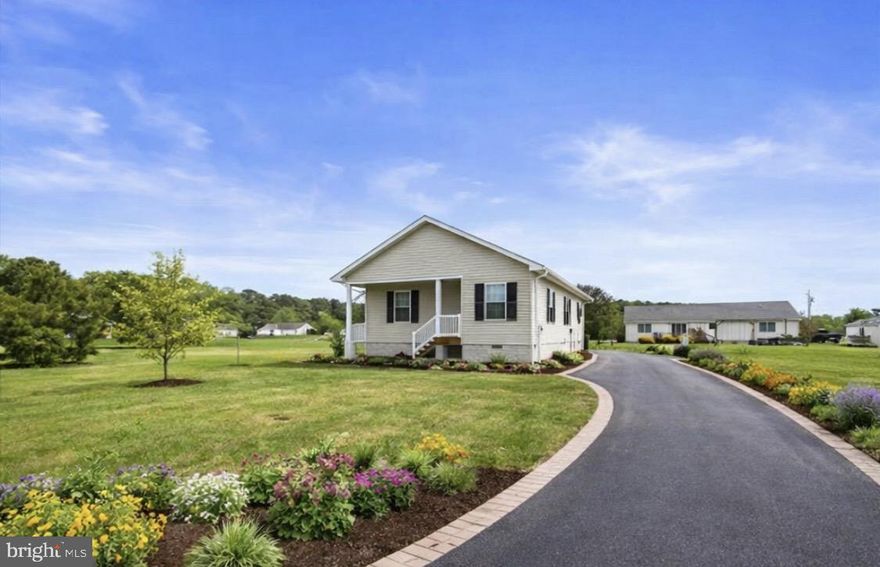 Brand-new construction on a spacious double lot in Nanticoke Acres — a rare opportunity to own a never-lived-in home with space to grow in one of the Eastern Shore’s peaceful waterfront communities.  Settle in now and look forward to the best of Eastern Shore living as spring arrives, with peaceful coastal surroundings just minutes from Salisbury and a short drive to Ocean City and Assateague. This brand-new 3BR/2BA home, is just steps from the water in the waterfront community of Nanticoke Acres, sits on a spacious double lot of nearly 30,000 sq ft of open, level ground that feels like your own private retreat. Whether you dream of a garden, firepit area, detached garage, or room to expand, this property is truly a blank canvas ready for your design vision.

Step inside to a bright, welcoming interior featuring oak hardwood flooring in the living and dining rooms and the primary bedroom, with durable LVT flooring in the kitchen and baths. The kitchen is thoughtfully designed with soft-close cabinetry, under-cabinet lighting, GE stainless appliances, a pantry, and a bonus nook—perfect for a coffee bar or small workstation.

The primary bath offers a tiled walk-in shower with a subtle accent band, creating a clean, modern look. Wide 36" doorways throughout the home, pre-wired ceiling fan connections in every room, baths prepped for grab bars, and a whole-house fire-suppression system provide comfort, accessibility, safety, and long-term peace of mind. The laundry room includes a GE washer and dryer along with an owned water-treatment system, while the large floored attic offers excellent storage.

Outside, enjoy a low-maintenance exterior with vinyl siding, aluminum/PVC trim, a new well, and a new environmentally friendly septic system. A voluntary community association (approximately $50/year) offers optional pier access for fishing, crabbing, and soaking in beautiful Nanticoke sunsets.

A great opportunity to enjoy a brand-new home and a double lot in one of the Eastern Shore’s most peaceful waterfront communities—ready for you to make it your own and enjoy the seasons ahead.

“Some photos have been virtually enhanced and/or virtually staged for illustrative purposes to show property potential.”
