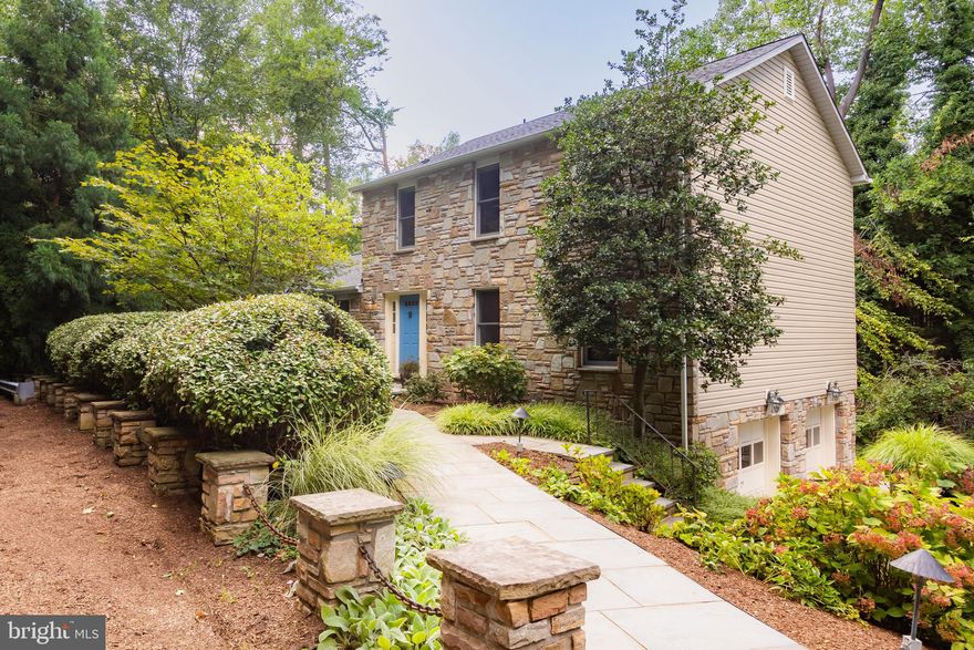 Beautiful stone-front colonial in the desirable West Towson neighborhood. Enter the main level to find brand new hardwood floors throughout and a newly renovated half bath. The spacious Living Room and separate Dining Room are perfect for family gatherings. The eat-in kitchen features quartz countertops, stainless appliances, an island and French doors leading to the Fiberon composite deck with lighting that runs the length of the house and overlooks the creek below (Nov. 2022). The generously sized Family Room with wood-burning fireplace, recessed lighting and built-in bookshelves leads to the wet bar with wine fridge. Continue to the laundry area which is separated from the wet bar by a convenient pocket door. Upstairs you will find four bedrooms and the renovated Primary and Hall baths. The fully finished lower level provides a large recreation space with a second wood-burning fireplace, ample storage, and doors leading to the stone patio. Enter from the two-car garage to the mudroom with built-in cubbies and the utility room housing the water heater(2020) and Carrier Infinity Heat Pump (Feb.2023). The roof and siding were also replaced in 2023. The extensive landscaping around the 1 acre lot was designed by world-renowned architect Wolfgang Oehme. See the flyer for a complete list of features and updates.