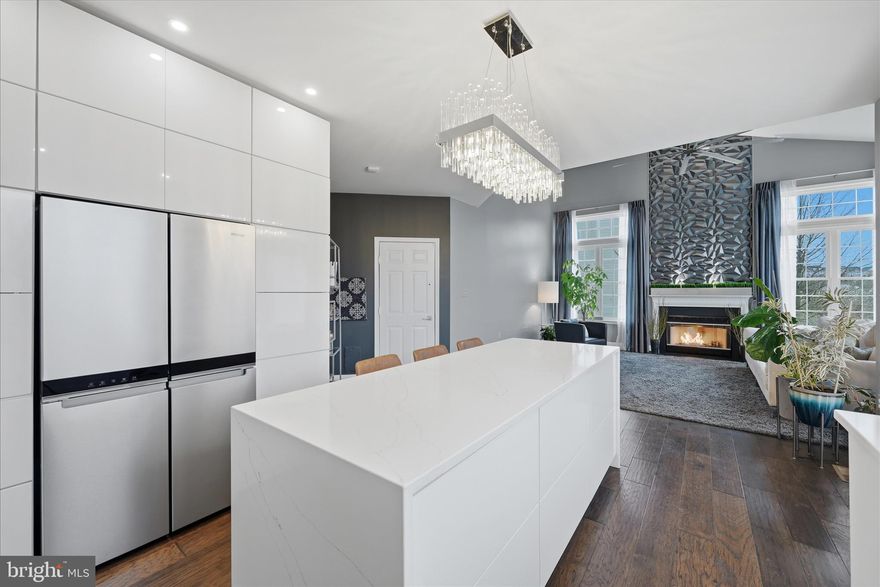 Step into this stately home nestled on a quiet cul-de-sac, where thoughtful design and luxurious upgrades create an unforgettable first impression. The moment you cross the threshold, you’re greeted by a soaring floor-to-ceiling foyer showcasing unique details—including a custom wood and plexiglass staircase that sets the tone for the craftsmanship throughout. Continue into the open, airy family room, where a striking textured wall extends from the elegant fireplace all the way to the ceiling. Oversized tinted windows flood the space with natural light while filtering out harsh rays, creating a warm, inviting glow. To the right, the newly renovated kitchen will delight any home chef. Outfitted with premium counter-depth KraftMaid Maris-style high-gloss white cabinetry, a hidden coffee bar that opens with a gentle tap, and a GE Café commercial-style 6-burner gas range with double ovens and a stainless steel pot filler—this kitchen is both functional and stunning. Quartz countertops extend across the space, including a waterfall island with cascading edges, perfectly suited for cooking, gathering, or entertaining. From the sink, enjoy a lovely view through the expanded modern window, or step out through the new Pella sliding doors with built-in blinds to the oversized deck—ideal for your morning coffee or evening relaxation. Downstairs, the lower level offers a full 2-bedroom in-law suite complete with its own kitchen, living area, and full bath. Sliding glass doors open to a spacious stamped concrete patio, accompanied by a circular entertaining area shaded by custom Italian sail awnings from Maanta. Enjoy evenings by the firepit or spend weekends tending to the tiered raised garden beds—ready for your spring plantings. And here’s the bonus: thanks to the addition of solar panels, the average electric bill comes in around $25 per month, bringing exceptional efficiency to this extraordinary home. Make sure to add 1709 Fairleigh Ct to your must-see list—this exceptional property combines design, comfort, and sustainability in one remarkable package.