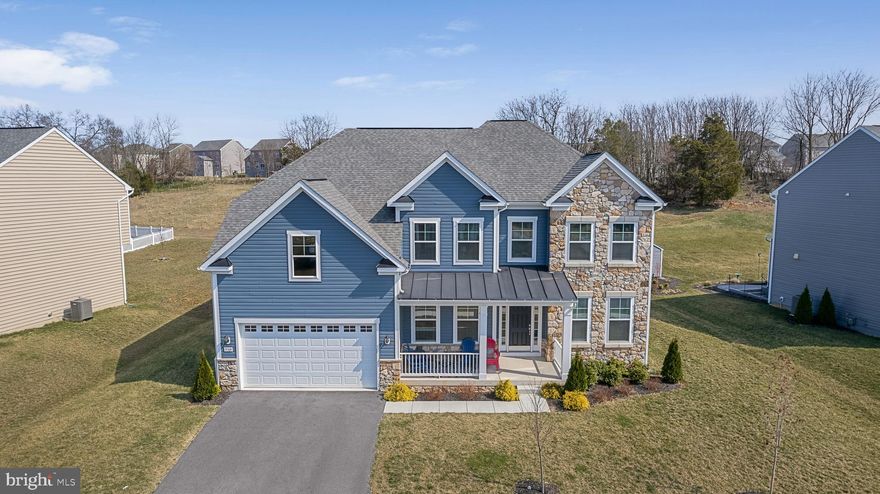 Price reduced for immediate sale! Finally you are home! A home where timeless style, generous space, and an unbeatable location effortlessly come together. This exceptional residence offers a lifestyle that feels both elevated and inviting. Showcasing the charm of new construction without the wait, the home welcomes you with a stunning stone façade and beautifully refined curb appeal that immediately captures attention.

Step inside to a bright and expansive open-concept layout, where soaring ceilings in the living room create a sense of grandeur and airiness. Natural light pours in, enhancing the home’s elegant ambiance, while a thoughtfully designed accent wall adds a modern, designer touch. At the heart of the home, the contemporary kitchen impresses with an extended, oversized island which is perfect for hosting, gathering, and enjoying everyday moments in style.

Upstairs, you’ll find four generously sized bedrooms, including a serene and comfortable primary suite designed for rest and relaxation. The fully finished lower level adds even more versatility, featuring an additional bedroom and flexible living space ideal for guests, a home office, or a private retreat. With 3.5 beautifully appointed bathrooms, every detail has been curated for both functionality and sophistication.

Situated within the highly sought-after Westfields community, residents enjoy access to resort-style amenities including a sparkling pool, tennis courts, basketball courts, and a welcoming clubhouse. The convenience continues with Rockland Elementary located right within the neighborhood.

Perfectly positioned near shopping, dining, Walmart, Wawa, gas stations, and major commuter routes—including easy access to I-70—this location offers both comfort and connectivity.

Spacious, refined, and ideally located as this is more than just a home, it’s a lifestyle upgrade. Homes like this don’t stay on the market for long. Schedule your private tour this spring and experience it for yourself.