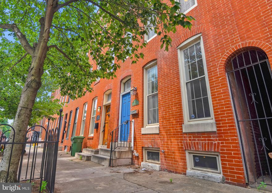 Welcome to this move-in ready rowhouse located near the heart of historic Federal Hill less than a one mile walk to the Baltimore Ravens' Stadium and the Orioles' Camden Yards. Off street parking pad behind the house can accommodate two vehicles, plus two residential Zone 30 street parking passes will be provided at time of sale. This inviting, spacious home features exposed brick walls, refurbished pine hardwood floors throughout most of the house, abundant living space, 2 large master suites, a fenced back patio and a two-level rooftop deck with stunning views of the city skyline. Stainless steel appliances, recessed lights and tall ceilings.