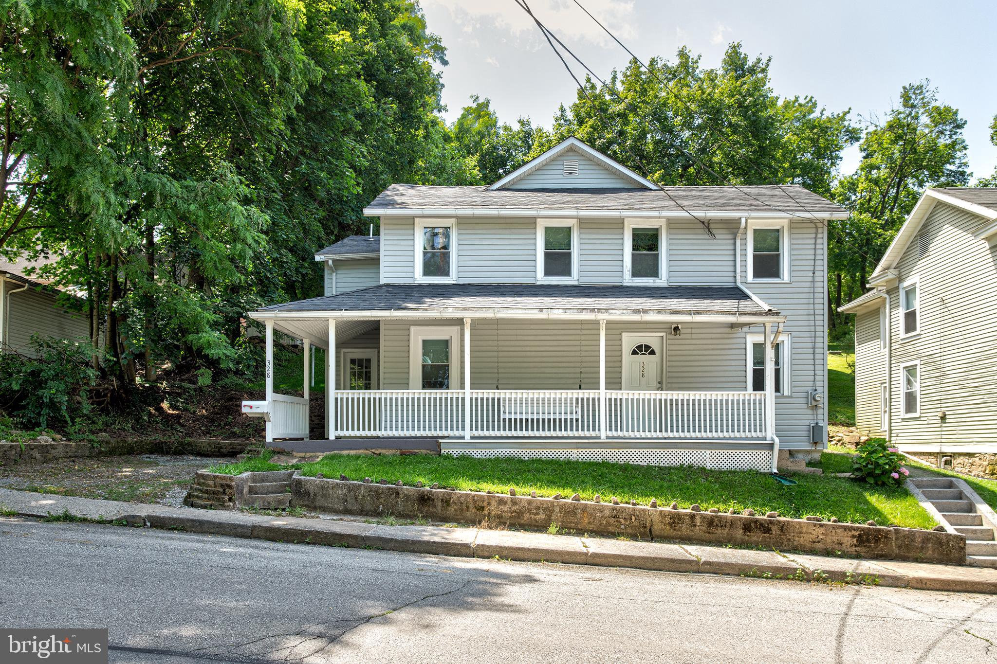 Welcome to this attractive home in proximity to downtown Bellefonte amenities and activities. A large covered front porch draws you into a nicely remodeled home featuring a spacious eat in kitchen with tile floors and maple cabinets, recessed lighting, newer flooring and freshly painted. The second floor features a nice owner suite on the second floor with a light and bright bathroom and spacious walk-in closet, and an extra bathroom to share with the other bedrooms. Great improvements include roof redone in 2014, composite flooring for covered porch installed 2022 and luxury vinyl flooring installed in 2023. An attractive terraced landscape provides a relaxing area after a long day. A commodity in Bellefonte, there are two off street parking spaces next to the house and also an additional access to property from the alley in the rear.