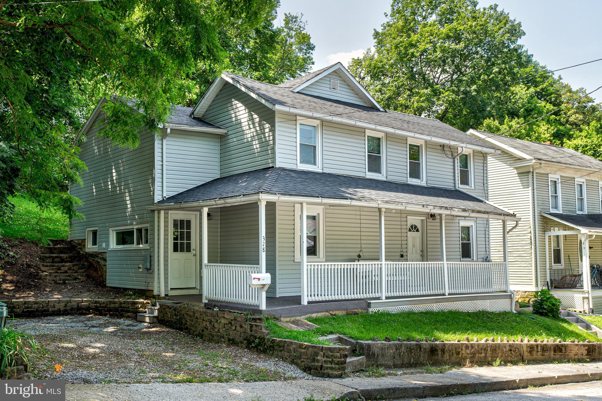 OPEN HOUSE - Sunday, September 14th, 11:30 AM - 1:00 PM. Welcome to this attractive home in proximity to downtown Bellefonte amenities and activities. A large covered front porch draws you into a nicely remodeled home featuring a spacious eat in kitchen with tile floors and maple cabinets, recessed lighting, newer flooring and freshly painted. The second floor features a nice owner suite on the second floor with a light and bright bathroom and spacious walk-in closet, and an extra bathroom to share with the other bedrooms. Great improvements include roof redone in 2014, composite flooring for covered porch installed 2022, luxury vinyl flooring installed in 2023, and vinyl tilt out windows. An attractive terraced landscape provides a relaxing area after a long day. A commodity in Bellefonte, there are two off street parking spaces next to the house and also an additional access to property from the alley in the rear.
