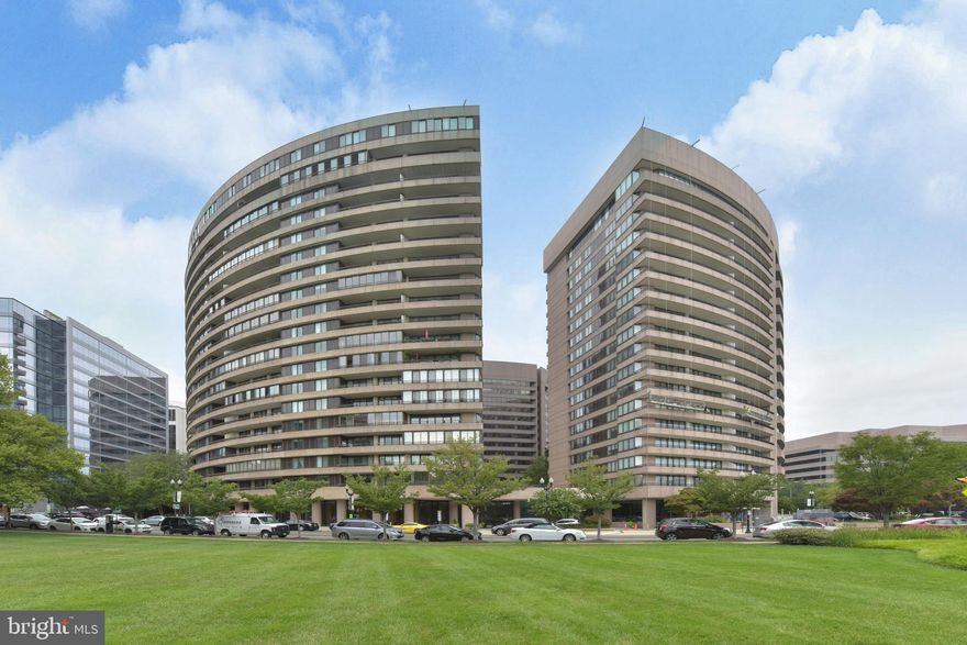 Two blocks from future Amazon Headquarters. //// Stunning spacious, absolutely beautifully renovated 2,139 sf three bedroom, 2.5 bath 6th fl unit with East & West balconies and terrific views, including views of the Potomac River for half the year. //// Gourmet kitchen including beautiful custom cabinetry - maple with a natural finish. Upper cabinets are 36 inches high and there are 2 lazy susan cabinets - lots of storage. Glass doors in some of the upper cabinets. Under counter lighting is newest digital lighting technology ( ie circuit boards). No bulbs required and estimated lifetime of 25 years. All lighting fixtures can be dimmed throughout the unit. Counter tops are granite with glass tile back splash. Newly painted walls have eggshell finish for easy cleaning. Appliances: Bosch induction stove with standard and convection oven capability and a heating draw (Response in using induction is same as with gas used by professional cooks), Bosch Microwave with convection capability, Bosch top of the line dishwasher. GE Profile frig and bottom freezer; new disposal, ceramic tile floor. Electrolux high end front loading washer and dryer. //// Marble Master Bath, Bathroom 2 granite counter and stone floor, Bathroom 3 travertine marble floors and walls. //// Hardwood Floors throughout. All woodwork/moldings have been replaced ; solid panel doors and hardware added. Wet Bar & Custom Lighting. Outlets for cable and multiple phone lines. ///// Extra storage. 1 Parking space Included. Other car parking easily leased; Condo fee includes water (hot and cold), sewer, and part of heating and air conditioning since water is delivered to the heat pump @ 68 degrees; indoor + outdoor pools; fitness center; sauna; Concierge 24X7 Secure. ///// Easy walk underground to Metro, shopping & Dining, Tuesday Farmers Market, Whole Foods, Public Library and Post Office and soon to be completed Movie Theater, more indoor and outdoor restaurants. Adjacent to Long Bridge Park with its 30 acres of recreation and open space, soon to be completed natatorium and Red Center. Access to many miles of bike/jogging/skating trails extending throughout northern Virginia and DC. VRE and Airport within minutes. FREE VISITOR PARKING: 1) IN 1300's VISITORS SPOTs 24x7 (tell front desk); or 2) in PMI Parking noted by large blue circle sign with P, AFTER 4 PM M-F, and ALL DAY Sat-Sun; and 3) ON STREET on SUNDAY. No Pets Allowed. Service dog only. Note: TV and its mount convey, but chandelier and drapes in master bedroom do not.