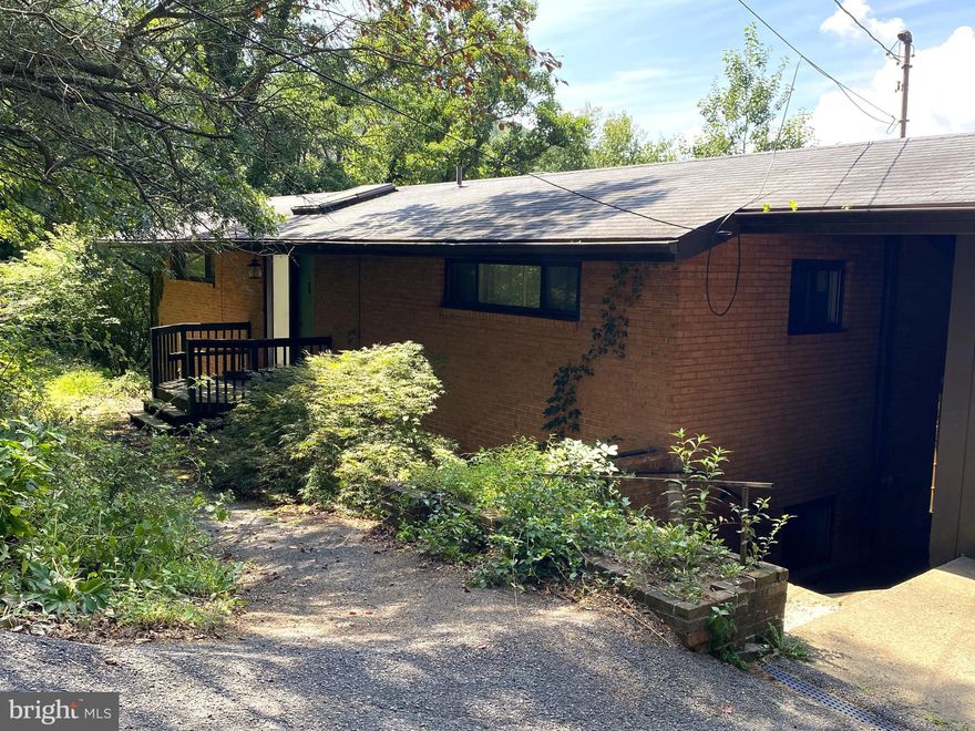 Discover the charm of this unique property, "Pine Pointe," a stunning split-level home nestled at the end of a quiet street. Boasting 4 bedrooms and 3 bathrooms, this residence offers plenty of space for family and entertaining. The main floor is designed for gatherings, featuring soaring cathedral ceilings, abundant natural light, and spacious, welcoming rooms. Cozy up by the beautiful brick fireplaces in both the living room and family room, perfect for relaxing evenings. 

With its impressive views overlooking Lavale—once featured on the Travel Channel—this home truly stands out. Located close to all amenities, it combines scenic beauty with convenience. This property has incredible potential and won't last long. Call today to schedule your private tour and experience all that Pine Pointe has to offer!