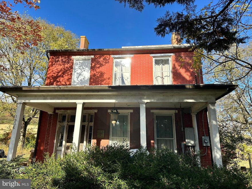 Welcome to 1936 Old National Pike, a historic, brick-constructed home built around the turn of the last century, situated on nearly 4 acres along Old National Pike in Middletown, MD. Investors, flippers, and restoration experts, attention! A rare opportunity in Middletown, this turn-of-the-century brick home sits on almost four acres along Maryland’s historic Old National Pike. The property offers substantial upside for buyers prepared to take on a full-scale renovation, with large interior spaces, classic brick construction, a metal roof, and mature surrounding acreage. The home, built circa the turn of the last century, is listed strictly "as-is" and is currently not move-in ready. It offers a durable metal roof and generous interior space, but it needs a comprehensive overhaul. The Land & Outbuilding is nearly four acres, feature mature acreage and include a spacious outbuilding/barn structure with existing electric service. This asset can be used as a workshop, studio, storage, or for conversion. Historic Significance: This is a true piece of local history, positioned directly on Maryland’s original National Pike Road. This home is for the buyer dedicated to preservation; it provides the opportunity to bring a landmark property back to its former glory. Conservation Easement: The Maryland Environmental Trust (MET) Conservation Easement covers the property. This is an optimal acquisition for an experienced house flipper or investor looking for a major value-add project with significant potential ROI after full restoration.  Ideal for buyers who value privacy, history, and the potential to make this property their own.