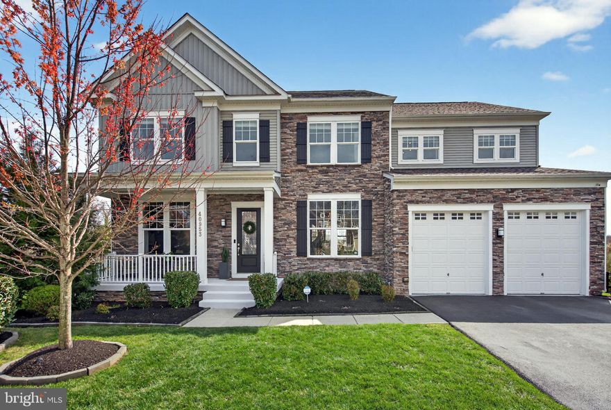 Experience the pinnacle of refined living in this immaculate, three-level masterpiece home. Positioned on a premier, private cul-de-sac, this home impresses with soaring ceilings and a vast, open floorplan designed for modern living.

The main floor features a chef’s dream kitchen showcasing a massive center island, high-end finishes including quartz countertops, and a spacious walk-in pantry. The stunning morning room offers panoramic views of the lush grounds, while the living room invites cozy evenings by the signature stone fireplace. Includes a formal dining room for elegant hosting and a private den/office—perfect for the modern professional.

The second floor boasts a sprawling primary suite featuring tray ceilings, a dedicated sitting area, and a boutique-style walk-in closet with a custom organization system. Indulge in a primary bath with floor-to-ceiling tile work and premium glass shower doors. Three additional spacious bedrooms, each boasting its own walk-in closet, ensures comfort and privacy for family and guests alike. Two secondary bathrooms are beautifully appointed with stylish, upgraded tile.

The fully-finished basement features a state-of-the-art home theater and dedicated golf simulator (both available for separate negotiation), a private home gym and an additional bedroom with a full bath—ideal for long-term guests or additional office space. Walk out directly to a designer paver patio featuring a luxurious 8-person premium Master Spa hot tub.

Perched at a higher elevation, the exterior of this home is truly breathtaking. Host sunset dinners on your Trex deck, overlooking an expansive, fenced backyard that feels like a private park. Mature trees, elegant plantings, pristine paver stonework, and stunning landscape lighting  create a lush, tranquil atmosphere. Includes additional under-stair storage for added convenience. The spacious, two-car garage boasts brand-new epoxy floors and freshly painted walls. 

This home has been exquisitely maintained, offering a brand-new feel, with high-end finishes and top-of-the-line features!

Excellent proximity to elementary, middle, and high schools. Neighborhood amenities feature a gathering pavilion and ample recreation space, including a playground and soccer field.