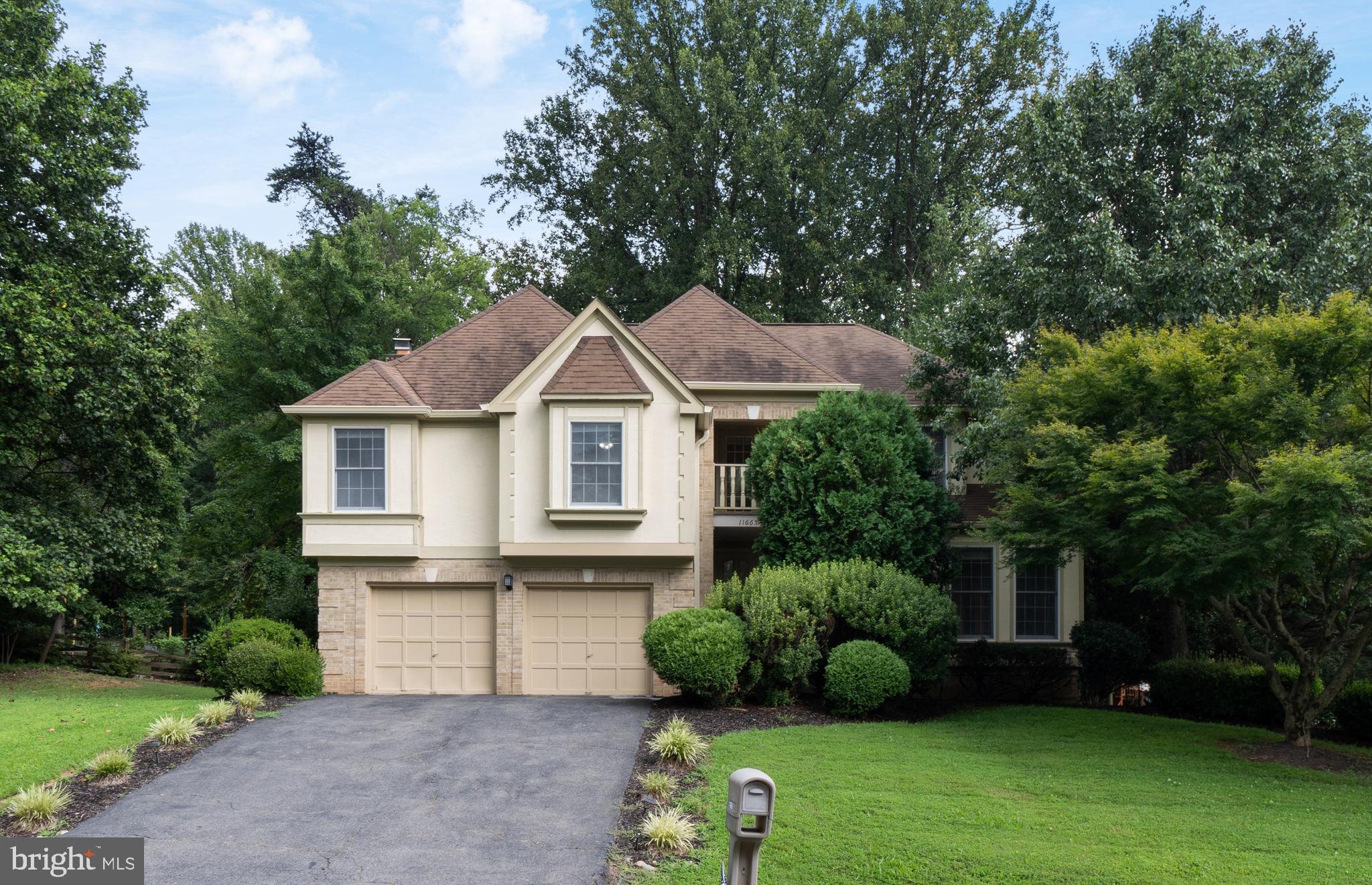 Welcome to this beautifully updated single-family home located in the desirable Shaker Woods community. This residence seamlessly blends elegant design with functional living spaces, perfectly suited for contemporary lifestyles. Upon entry, residents are greeted by new luxury vinyl plank flooring throughout the main level, enhancing both durability and aesthetic appeal. The remodeled eat-in kitchen is a culinary enthusiast's dream, featuring 42” white shaker cabinets, sleek quartz countertops, stainless steel appliances, a double oven, and an abundance of natural light from numerous windows. A convenient dry bar with quartz countertops and glass-front shelving is ideal for entertaining. The family room offers a cozy ambiance with a wood-burning brick fireplace, complete with a ceiling fan and double doors leading to a spacious two-level wooded deck. The formal living and dining rooms showcase elegant crown molding and chair rails, adding a touch of sophistication. A main-level laundry room with shelving and a powder room complete this level.
The expansive primary suite serves as a tranquil retreat, featuring hardwood floors, two sitting rooms/offices with built-in shelving (one with access to a private deck), and an impressive walk-in closet. The en-suite primary bathroom is a spa-like haven with dual sinks with upgraded countertops, ample storage, a frameless stall shower, a soaking tub, and a private water closet. Three additional bedrooms, two with walk-in closets, offer brand new plush carpeting and share a hall bathroom with dual sinks and a tub/shower combination. The finished lower level provides a large recreation room, a versatile den or workout room, and a storage room with a utility sink & Epoxy Flooring, ensuring ample space for hobbies and storage needs. Outside, residents can enjoy fresh landscaping and the serene, wooded setting of the two-level deck. The Shaker Woods community offers walking and jogging paths, streams, and parkland, creating a peaceful environment ideal for nature enthusiasts. The property is also centrally located, offering convenient access to Route 7 and the Fairfax County Parkway, and is situated 4 miles from the Wiehle-Reston East Metro Station, 4 miles from Reston Town Center, and 8 miles from Dulles Airport. This residence truly offers an exceptional living experience! Welcome Home!