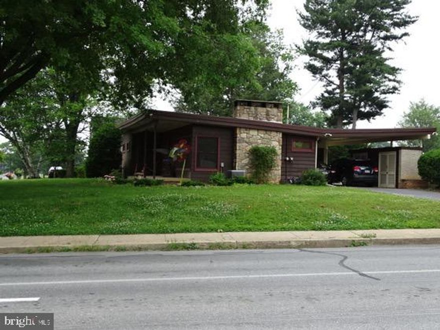 1955 Classic Mid Century style one story home. 2 bedroom, 1 bath, kitchen, dining with high ceiling, living room with fireplace. Basement offers laundry, furnace/storage, 1 additional finished room. 2 car carport. Large enclosed rear patio. Anderson window installed 2018.  Corner location, home sits back on the lot. Many local conveniences.