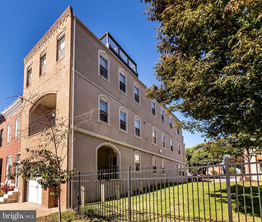 Extraordinary end of group with attached garage and additional parking space in prime Canton location!  This expansive, light-filled unique town home was constructed in 2007 and boasts 3,700 sq. ft. of amazing living space with 4 bedrooms, 3 full baths and 2 half baths.  The home has been enhanced with handsome cherry wood flooring throughout, stunning metal  and wood staircase, recessed lighting, window treatments, sumptuous baths, and neutral finishes.  The residence features an open floor plan on the main level to include an  inviting entry, dramatic two story living room with handsome built-ins, eye-catching large ceiling fan, and gas fireplace, lovely separate dining room, incredible gourmet kitchen with commercial stainless steel appliances, upgraded granite countertops, island and breakfast bar, quaint atrium, half bath, and significant closet space.  The second floor has an amazing overlook to the main living area, two en-suite bedrooms and baths, an additional bedroom, and a spacious laundry room.  The top level includes a fabulous large Master Bedroom /Bathroom Suite and an incredible family room with gas fireplace, wet bar with built-ins and balcony great for entertaining or relaxation.  The interior accessed 17 X 13 roof top deck is perfect for entertaining and enjoying the spectacular panoramic views of the water and cityscape.  The home is located close to Canton Square, Canton Crossing, Johns Hopkins, Maryland Medical Institutions, restaurants, bars, shopping, Downtown,  major highways, various neighborhoods and cultural events.