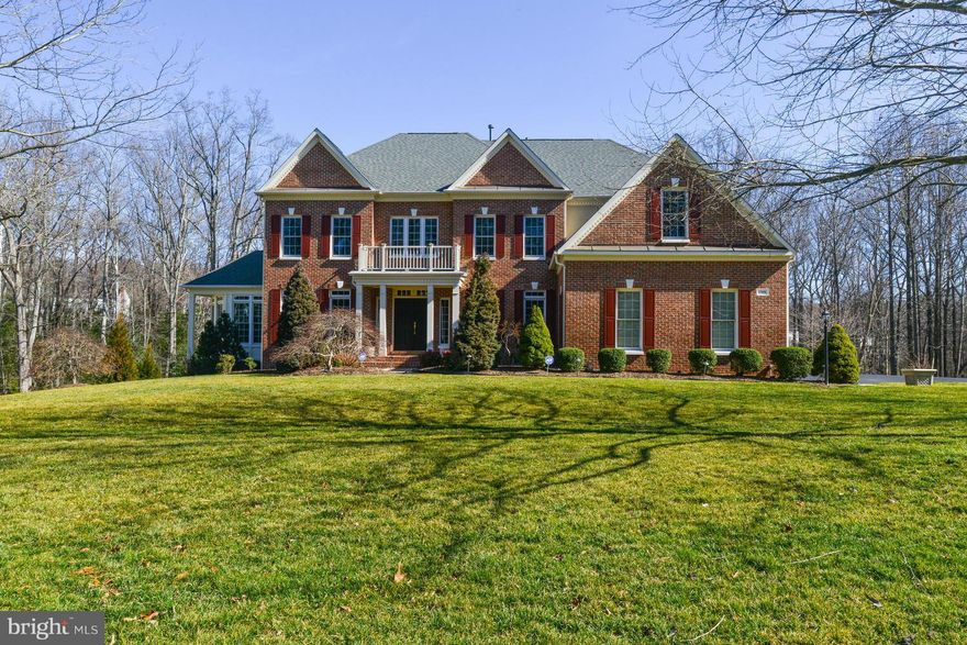 Pristine home located on a beautifully landscaped street * approx. 6,500 sq. ft. on 3 finished levels * hardwood floors * super-size kitchen * fabulous recreation room with wine fridge, beverage center & the bar conveys * irrigation system * 2 story entry & family room * owners suite with tray ceiling, enormous  bath/dressing area & closets * 5th bedroom & bath on lower level * home backs to trees