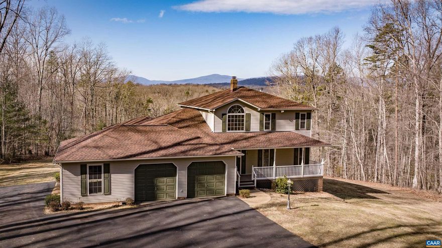 New to the market-A custom built home on 25+- mostly wooded acres, in a private, yet accessible location to US 29, in Madison County.  The residence was built in 1996, with 4 bedrooms, 3.5 baths and having 2,780+- square foot of heated living space.  Elk Run stream borders the northern property line, and a spring fed pond, is adjacent to the residence.  From the back porch, the views of the Blue Ridge Mountains are truly impressive and relaxing.  Attached oversized garage with workshop, as well as another work space in the basement.  Detached equipment/storage building.  This exceptional property is within 25 minutes to Charlottesville.,Formica Counter,Oak Cabinets,Wood Cabinets