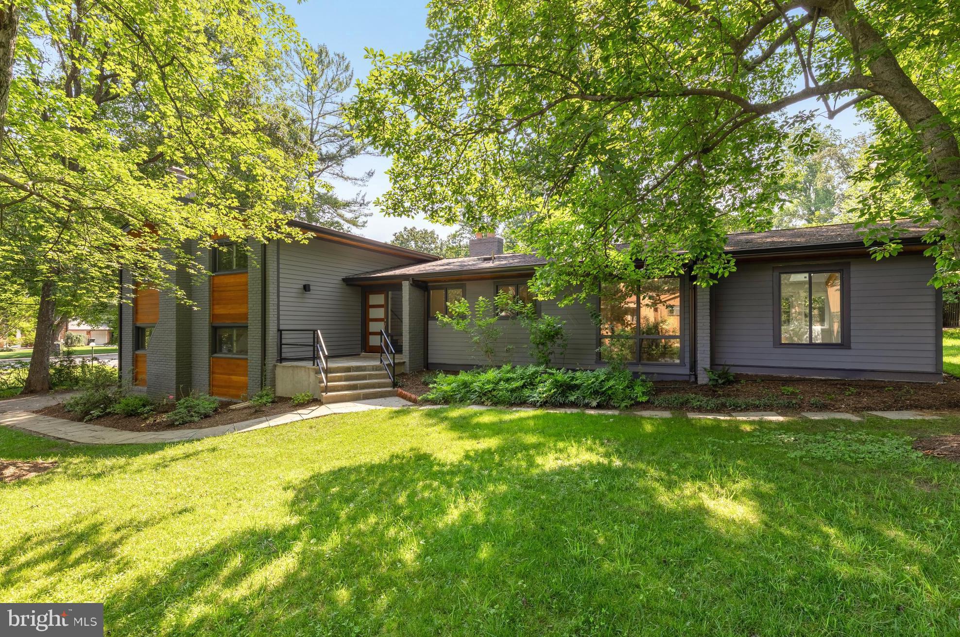 Freshly staged and a new price! Welcome to 11604 Danville Drive, a recently refreshed mid-century modern home in the heart of the highly desirable Luxmanor neighborhood! This spacious residence features 5 bedrooms and 3.5 bathrooms on a half-acre lot, thoughtfully designed for modern living and effortless entertaining.The open-concept layout features a gourmet kitchen with premium finishes, a spacious dining area, and a cozy living room with a fireplace, as well as walk-out access to the yard.
An expansive sunroom is filled with natural light and surrounded by windows that bring the outdoors in. Whether you use it as a second family room, a home office, or a relaxing retreat, this versatile space offers year-round comfort and connection to the beautifully landscaped backyard.
The upper level features a generous owners suite with ensuite bathroom and a walk-in closet, three additional bedrooms and hall bath to match. The lower level offers a massive family room with a wood-burning fireplace, laundry room, an additional bedroom and bathroom, and access to the attached two-car garage. An optional wet bar/kitchenette installation is possible to provide multigenerational living options - inquire with agent.
New Andersen windows are set to be installed throughout the home in the coming weeks!
Located just a 13-minute walk to the Tilden Woods Park & Pool, residents can enjoy access to tennis courts, a swimming pool, basketball courts, softball fields, playgrounds, and scenic trails. 5-minute drive to the shops and restaurants of Pike and Rose. 7-minute walk to Luxmanor Elementary School and Tilden Middle School. 6-minute drive to Walter-Johnson High School. Easy access to I-270 and I-495, and a 6-minute drive to North Bethesda Metro (Red).