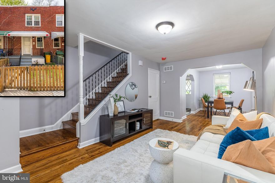 Updated Hampden Row Home located directly across from the Rotunda.  Location is everything - walking distance to tons of shops and restaurants.  Enter into your living area with beautifully refinished hardwood floors that seamlessly flow through to the dining area.  Enjoy a remodeled kitchen with new flooring, white shaker cabinetry, stainless steel appliances and granite countertops.  The refinished hardwood floors continue upstairs where you will find two generously sized bedrooms and an updated full bathroom.  The partially finished basement makes for a great den/office and conveniently features a half bathroom.  Enjoy relaxing on your large deck in your fully fenced in back yard or on your concrete patio in your fully fenced in front yard.  This home has just been completely painted and features many updates so you can pack your bags and move right in.  This house is vacant and easy to show so schedule your showing today!