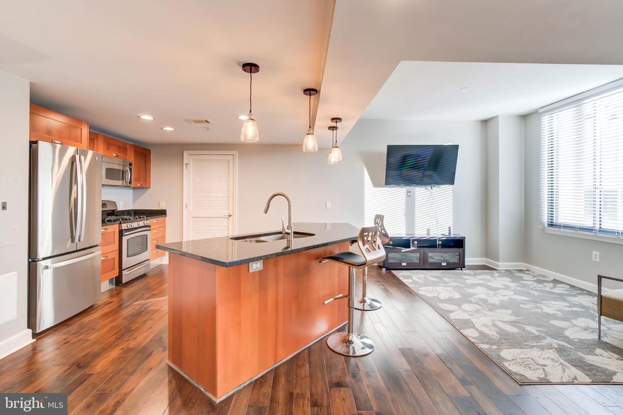 Wow! Spacious 2 bed +den,  2 bath condo with open floor plan, hardwood floors throughout and plenty of storage! Upon walking in you will be wowed by the open kitchen with stainless steel appliances. The laundry room off the kitchen has lots of storage space. The living room has high ceilings and large windows- so much light! A separate dining room provides a great entertainment area. Two great size bedrooms, and one with en suite bath. An extra den is great for an office space. Move in ready!
Midtown Station is conveniently located across from Huntington Metro and offers many amenities, including 24 hr concierge, pool, gym, party room and garage. The unit includes one garage space and one assigned space in the lot. 
Available now. Tenant pays gas and electric, as well as $250 move in fee and $500 refundable elevator deposit.