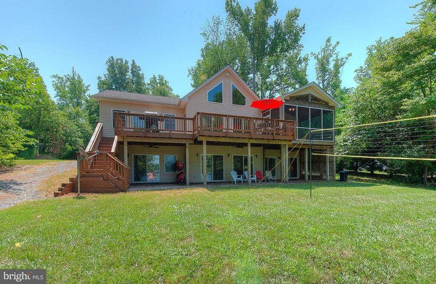 Welcome to your new lifestyle located along the tranquil shores of Lake Anna, Virginia. A true paradise for you to relax and make unforgettable memories.  This retreat is non HOA and nestled on a 1 acre lot on the private side of the lake.  Gorgeous views, 92 feet of rip-rap shoreline,  a large sandy beach and sun deck!  3 bedrooms, 3.5 baths, and a home office or game room. You will love the open floor plan with vaulted ceilings, and each bedroom has its own full bath.  Finished walkout basement with a family room, game room and laundry.  Screened in porch overlooking the lake and a patio with an outdoor shower!  This home comes fully furnished and is turn key making it ready for your enjoyment!