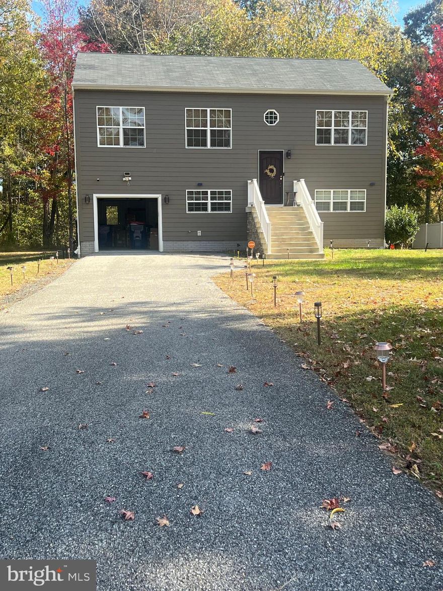 Property has recently been appraised for list price. Beautiful move-in ready 4 bedroom 3 full bath single family home located on a quiet street and one block off the water.  The upper level has a large family room open to the kitchen and dining area. The 3 upper level bedrooms are large with the owners suite having private bathroom with ceramic shower and modern fixtures and vanity. The hall bathroom is enhanced with ceramic tile and upgraded vanity. Lower level basement has 9 foot ceilings with a huge 2nd family room with an additional 4th bedroom and 3rd full bathroom. The property is located on a huge flat lot and has plenty of privacy. All vinyl siding has been replaced ($40,000.00) with James Hardie siding which is a mixture of fiber-cement siding.