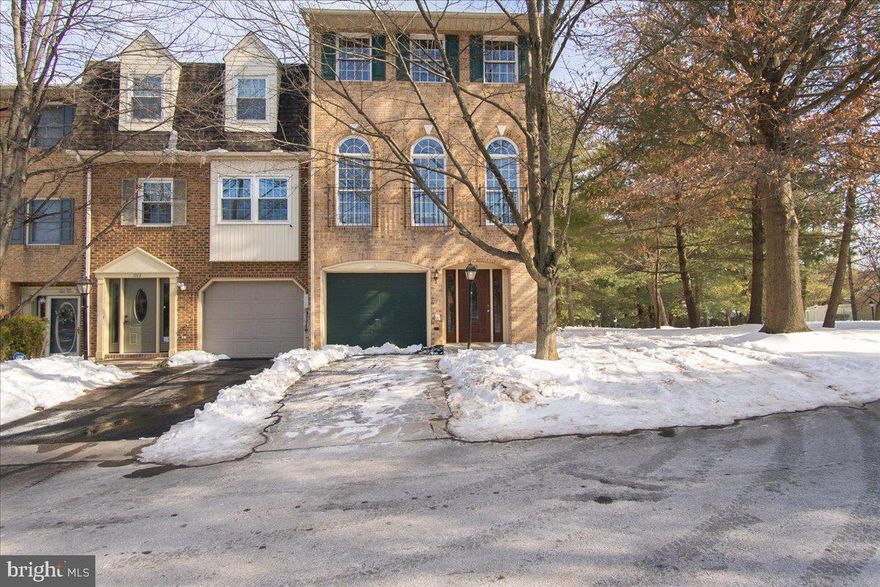 This beautiful end unit townhome offers move-in ready amenities and updates.  From the all brick exterior, to the rear deck and main level covered patio, this home is exceptional in every way.  The deck and patio overlook forested common areas that offer community walking trails and mature landscaping. 
 
Step through the front door and you'll find yourself in an expansive foyer complete with tile floors, two storage closets and access to the attached 1-car garage.  The main level features a convenient half bath and a sunken family room with 10-foot-tall ceilings and French doors to the rear covered patio.

Moving to the 2nd level you arrive at the homes sunken living room featuring hardwood floors, 10-foot ceilings, and beautiful circle-top windows that flood the space with afternoon sunlight.  Adjacent to the living room the homes open floor plan extends to the spacious dining area, breakfast area and custom kitchen.  The open floor plan allows for a variety of uses if two dining spaces are not needed.  The kitchen offers upgraded cabinets, modern black Corian counters, updated appliances, tile backsplash, recessed lighting and a center island complete with built-in storage and display shelving.  This floor plan is perfect for entertaining.  Adjacent to the kitchen you'll find French doors that lead to the private 12x14 rear deck, perfect for summer grilling and outdoor dining.

Heading to the 3rd level you'll find a convenient bedroom level laundry complete with washer and dryer.  There are two primary suites on this level, each offering spacious closet space, private full deluxe bathrooms and sizable bedroom living space.  The main suite features vaulted ceilings, his/her closets, and a private bath complete with skylight, tile walk-in shower and separate soaking tub.  

The community features plenty of amenities including paved and lite walking trails, community parks, playgrounds, club house, in-ground swimming pool, tennis courts and more.  The community landscaping creates a unique feeling with separation between clusters of townhomes, allowing one to achieve privacy where other communities do not.  This home is move-in ready and eagerly awaits its new occupants.