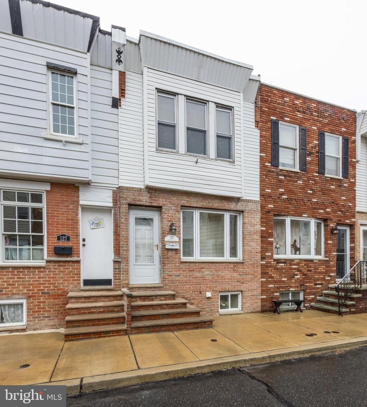 FINAL & BEST DUE 04/14 AT 6:00PM | Welcome to 125 Gladstone Street — a classic rowhome tucked away on a quiet block in South Philadelphia's Whitman neighborhood. Renovated in 2009, this charming home blends classic Philly character with modern touches.
Step inside to an open and inviting first floor featuring a tiled entryway and warm hardwood floors. The spacious living room flows effortlessly into the dining area, perfect for entertaining. Just off the living space is a convenient first-floor powder room. The kitchen offers stainless steel appliances, gas cooking, ample cabinet space, and a breakfast bar ideal for casual dining or hosting guests.
Upstairs, you’ll find three well-sized bedrooms with closet space and natural light. A full hall bathroom includes a full-sized tub, plus storage in both the vanity and medicine cabinet.
The finished basement offers even more flexibility — use it as a cozy den, home gym, or playroom. The laundry area is tucked neatly away in the mechanical room for easy access.
Don’t miss this opportunity to own a classic Philadelphia home with modern comforts in a great location!