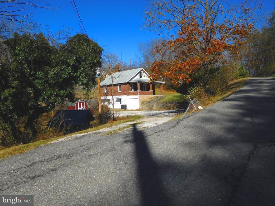 MOVE-IN READY! Check out this charming 2 bed 2 bath bungalow. Wood floors throughout, beautiful staircase, updated kitchen and bathrooms, spacious family room, replacement windows, partially fenced yard, and OVER AN ACRE of land! Minutes from I-68, ACM, & WMHS. It doesn't get better than this! Sale includes tax IDs 0122018523 & 0122012517 for a total of 1.13 acres