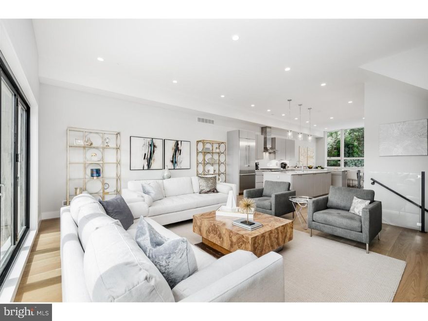 Welcome to Silver Hill -- A very special collection of 7 high-end ultra luxurious contemporary townhouses in the heart of Manayunk only to be found in the city -- Until now. These 4 BR/3.5 BA ultimate city homes with elevator have been thoughtfully designed by Canno Architecture for today's urban living. This is an end house with an entire side of industrial glass and an additional driveway for 2 cars. Entire facade is a very dramatic custom window wall. Enter into a 20+ foot wide living floor with soaring 11 foot ceilings. Open-concept dining room, fabulous chef's eat-in kitchen with sleek Thermador appliance package. Large living room with linear gas fireplace and custom built-in shelving and built-in cabinetry. Entire back wall of La Cantina Accordion style glass doors opens out to step-out deck with contemporary glass railings truly brings the outside in. Ascend to the second floor to the most fabulous master-suite oasis with 10 foot ceilings. Large Master BR with glass doors opening out to yet another step-out balcony also with contemporary glass railings. Western views with the most incredible sunsets. Runway style hallway features dual closets with custom built-in systems leads to a huge spa-like master bathroom complete with 2 vanities and 2 water closets on opposite ends of the bathroom. Over sized step-in shower with frame less glass doors and luxurious soaking tub. European bathroom finishes throughout furnished by Porcelanosa. Third floor features 2 guest bedrooms, large laundry room with custom cabinetry and counter tops plus a third guest suite with en-suite full bathroom which could also make a gorgeous home office. Ascend to the pilot house with large wet bar bar including beverage center perfect for entertaining. Two-sided rooftop deck - Entertaining side includes optional hot tub and spectacular views. Opposite side features a Rooflite soil green roof system with self-feed soil. 2-car attached rear garage plus bonus room which could be a great office/gym/playroom/mud room plus over sized coat closet. Many green features including tank less hot water heater, icynene spray foam insulation, green roof plus high efficiency dual Carrier HVAC system. 5-stop elevator. Easy access to Center City, transportation, highways and the suburbs. 10-year property tax abatement. Truly exceptional masterpieces with no expense spared for the most discerning buyer.