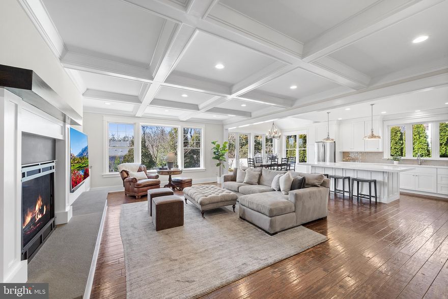 OPEN HOUSES CANCELLED!  Walk to downtown Malvern from this dazzling newer colonial featuring over $200,000 in upgrades! From the charming bluestone front porch, a glass-paneled mahogany door brings you inside, where you’ll find enhancements at every turn, including nine- and ten-foot ceilings, wide-plank hardwood floors, custom millwork and cabinetry, solid-wood floor-to-ceiling doors, recessed lighting and designer fixtures and hardware. From the foyer, pocket French doors reveal a sunny living room with scenic front and side yard views. Behind the living room you’ll find a soothing primary suite with dual walk-in closets and glorious ensuite bath featuring marble tile, extra-long custom vanity, glass shower with bench seating and water closet. Continue down the wide center hallway to the heart of the main floor—a sprawling, tastefully appointed family room-kitchen with high-end finishes galore. To the right, a sparkling white chef’s kitchen boasts island seating, upgraded cabinets, custom tile backsplash and microwave drawer. Just steps away, an open breakfast area offers a cheery place to sit and dine thanks to two sets of full-panel double glass doors that open to the backyard. The sumptuous family room welcomes all with its gas fireplace, coffered ceiling, custom built-ins and glorious window wall. Tucked behind the kitchen sits a spacious, fully appointed mudroom with custom cubbies and built-in desk and hutch. The mudroom conveniently connects to a three-car garage with wall slat organization system. A laundry room with soapstone countertops and pocket door, walk-in pantry and powder room complete this spectacular first floor. Upstairs you’ll find four spacious secondary bedrooms—all with custom closet organization systems—and two upgraded jack-and-jill full baths. An open staircase leads to the light-filled lower level, which the current owners lowered to create ten-foot ceilings and accommodate larger windows. In addition to an open space for relaxation and play, full bathroom and several storage closets, you’ll find a separate area with custom flooring that’s perfect for a home gym. The partially fenced, professionally landscaped backyard boasts a tiered composite deck that’s ideal for entertaining, plus a gas fire pit and flat, open greenspace just beyond. Homes on this tranquil, sidewalk-lined loop are zoned for award-winning Great Valley School District and sit mere minutes from premier shopping and dining, transit and commuter routes. Make plans to tour this Malvern marvel today!