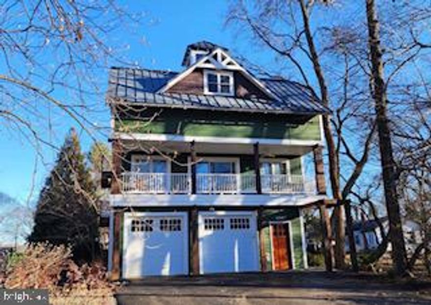 More details and professional photography coming soon, stay tuned! Architecturally distinctive and thoughtfully designed, this three-level contemporary residence offers 4 bedrooms, 2 full baths, and 2 half baths, all set on a corner lot in the established South Haven community. The home combines a flexible floor plan with curated custom details and multiple living spaces that adapt effortlessly to modern lifestyles. The entry level features a versatile bonus room that currently serves as a stylish home bar, complete with built-in elements and a nearby half bath. This space could easily transition into a private office, studio, fitness area, or guest suite depending on the next owner’s needs. The main living level is open and light-filled, anchored by a spacious kitchen with an oversized island, professional-grade gas cooking, and distinctive custom finishes. The kitchen flows seamlessly into the dining and living areas, creating an inviting environment for entertaining and everyday living. One standout feature of this home is the built-in dumbwaiter, offering effortless convenience for transporting groceries, firewood, and other essentials between levels. Upstairs, the primary suite offers a peaceful retreat with a private coffee bar, walk-in closet, and spa-inspired bath. Two additional bedrooms, a full hall bath, and an upper-level laundry area complete the sleeping level. A ladder-access rooftop lookout provides a unique bonus space and elevated 365 degree view of the Severn River and the neighborhood. Outdoors, mature landscaping and wooded surroundings offer privacy while maintaining proximity to community amenities. Extensive hardscaping, a detached storage shed, and pre-installed hot tub wiring enhance the backyard’s potential. Located just steps from the neighborhood park with convenient access to major commuter routes, this home delivers design-forward living paired with everyday practicality. Don't miss your chance to make this your new home!