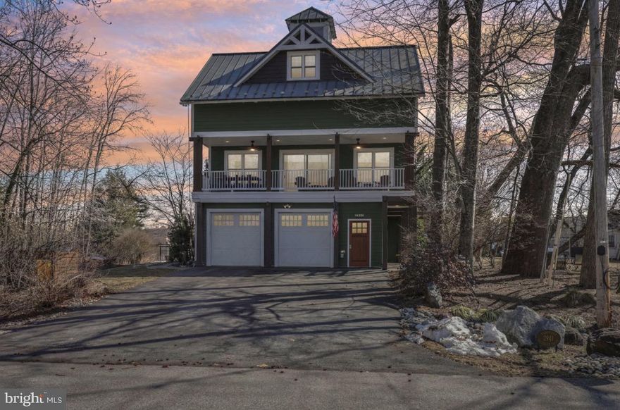Architecturally distinctive and thoughtfully designed, this three-level contemporary residence offers 4 bedrooms, 2 full baths, and 2 half baths, all set on a corner lot in the established South Haven community. The home combines a flexible floor plan with curated custom details and multiple living spaces that adapt effortlessly to modern lifestyles. The entry level features a versatile bonus room that currently serves as a stylish home bar, complete with built-in elements and a nearby half bath. This space could easily transition into a private office, studio, fitness area, or guest suite depending on the next owner’s needs. The main living level is open and light-filled, anchored by a spacious kitchen with an oversized island, professional-grade gas cooking, and distinctive custom finishes. The kitchen flows seamlessly into the dining and living areas, creating an inviting environment for entertaining and everyday living. One standout feature of this home is the built-in dumbwaiter, offering effortless convenience for transporting groceries, firewood, and other essentials between levels. Upstairs, the primary suite offers a peaceful retreat with a private coffee bar, walk-in closet, and spa-inspired bath. Two additional bedrooms, a full hall bath, and an upper-level laundry area complete the sleeping level. A ladder-access rooftop lookout provides a unique bonus space and elevated 365 degree view of the South River / Broad Creek and the Southaven Community. Outdoors, mature landscaping and wooded surroundings offer privacy while maintaining proximity to community amenities. Extensive hardscaping, a detached storage shed, and pre-installed hot tub wiring enhance the backyard’s potential. Located just steps from the neighborhood park with convenient access to major commuter routes, this home delivers design-forward living paired with everyday practicality. Don't miss your chance to make this your new home!