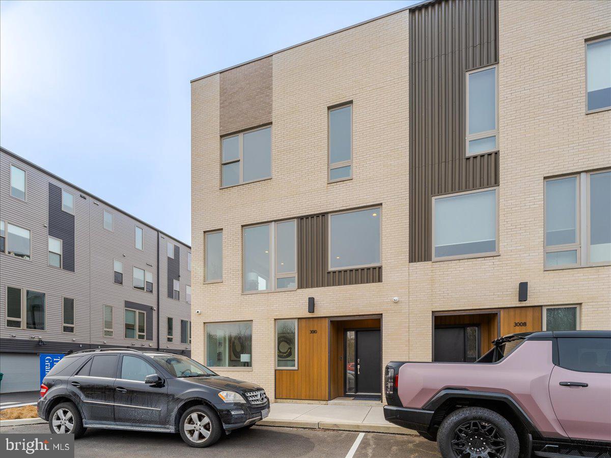 Welcome to 3010 E Cumberland Lane, a stunning new home in the Northbank Community on a prime corner lot with over $50,000 in upgrades, 2,500 square feet of living space, and a 2-car garage. Skip the wait for a new construction home and start enjoying a never-lived-in, move-in-ready home with over 8-years remaining on the tax abatement. As you enter your practically, brand-new, Grant-model home, you will be greeted by soaring ceilings and lots of natural light. You can also enter the home through the spacious, two-car garage. The entry level offers a spacious flex space that can easily serve as a study, den, home office, personal gym or home library. Walk up to the 2nd level to find an open floor plan, main living area with an abundance of natural light and surround sound - perfect for entertaining guests. Then you walk into your luxurious, chef’s kitchen featuring stainless steel appliances, quartz countertops, custom backsplash, tons of white cabinets, walk-in pantry, half-bathroom and a large island that is perfect for barstool seating. The third floor, you will find your primary suite with a walk-in closet and an en-suite bathroom that features double vanity sinks, beautiful countertops and tiles, and a glass door shower. You also will find 2 additional bedrooms with closets and another full bathroom and laundry. Walk up to your rooftop deck where you will find a dry bar and then step outside to your very own rooftop deck equipped with a wet bar that includes a refrigerator and grill station. Enjoy the breathtaking panoramic views that is perfect for gatherings with family and friends. Your favorite destinations are just moments away, allowing easy access to Fishtown and Center City. This home is the perfect blend of luxury and convenience. Schedule your private tour today!