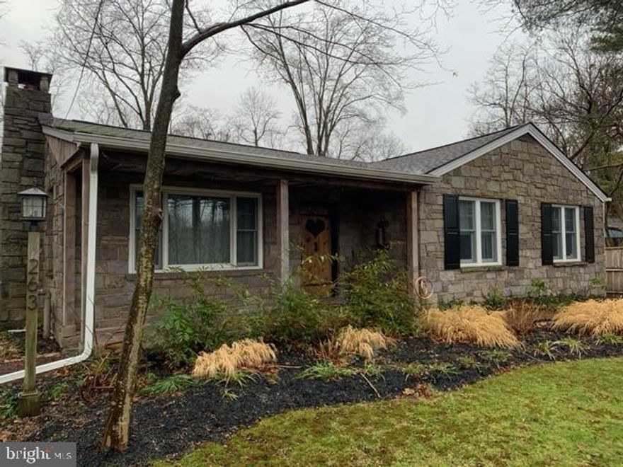 This  adorable stone rancher on the end of town  is deceiving for sure. Literally "the heart of the home," it is beautifully accented with a  glass heart on the entry door.  This home has been updated and renovated with thought and care, maximizing its use and square footage. It boasts an open floor plan, highlighted with neutral tones, wood flooring extending  throughout the home, and cozy wood burning fireplace.  The main living area flows into the new addition of a comfortably sized casual dining and entertaining room,  adjoined to a great country kitchen with stone counter tops, expansive island, stainless appliances,  and inviting seating that allows views of the stone patio and large backyard that backs the towpath.  Two spacious bedrooms share an updated, modernized full bath, while the comfy main suite has a lavish private full bath reminiscent of a spa. A partially finished lower level accessed with an open stair case leading to a full bathroom add to the charm and quaintness of this home. This property includes an oversized detached garage and work space,  spectacular and unobstructed views of the river.  Offering low taxes and walking distances to town center, and easy access to main arteries, this property encompasses two separate parcels, and is a great forever home. NO FLOOD INSURANCE REQUIRED!