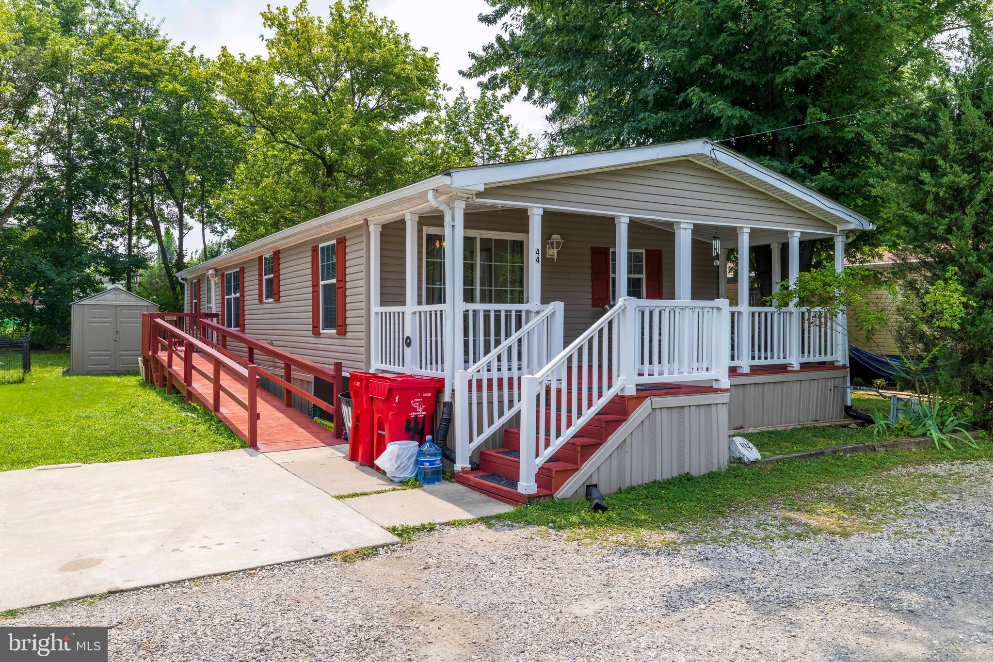 Rare Double Wide Liberty Arlington Classic Manufactured Home With Driveway! Located in the Neighbors of Eagle community and Methacton school district, cathedral ceilings and custom moldings showcase this spacious and gracious home! Sunlight streams through the windows and skylights creating a warm and cheery atmosphere. This beauty features a spacious living room, a master bedroom suite with walk-in closet and master bath, 2 additional spacious bedrooms with large closets, a 2nd full bath, a huge eat-in kitchen features 36" oak cabinets, generous counter space, pantry, laundry room, a huge breakfast/dining room area with sliding doors to the freshly painted relaxing front porch. Other features include the home being handicap friendly, a private driveway, rear yard, storage shed, a new roof, and new wood flooring and carpet being recently installed throughout. Conveniently located and surrounded by an abundance of shopping and dining. An extremely affordable and low maintenance home for the area! Priced To Sell!!