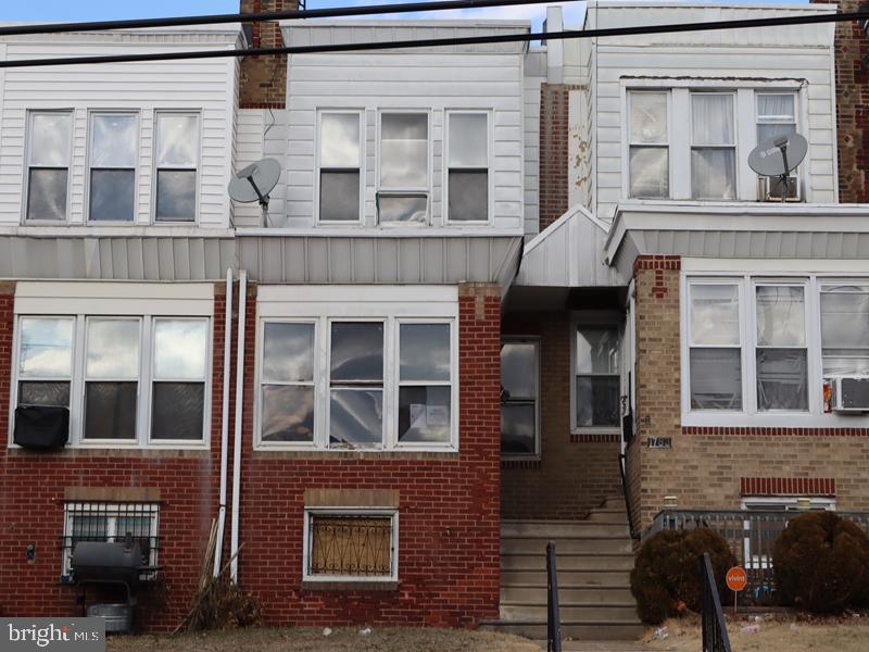 Welcome to this grand opportunity for this two-story brick row, property features a small front lawn. The interior boasts a spacious enclosed porch, living room, dining room, and kitchen. The upper level includes 3 sizable bedrooms and 3pc hall bath, with ample closet space throughout. The full unfinished basement offers walkout access to the rear garage and driveway. This property is conveniently located close to local shopping, schools, and minutes away from major ways.