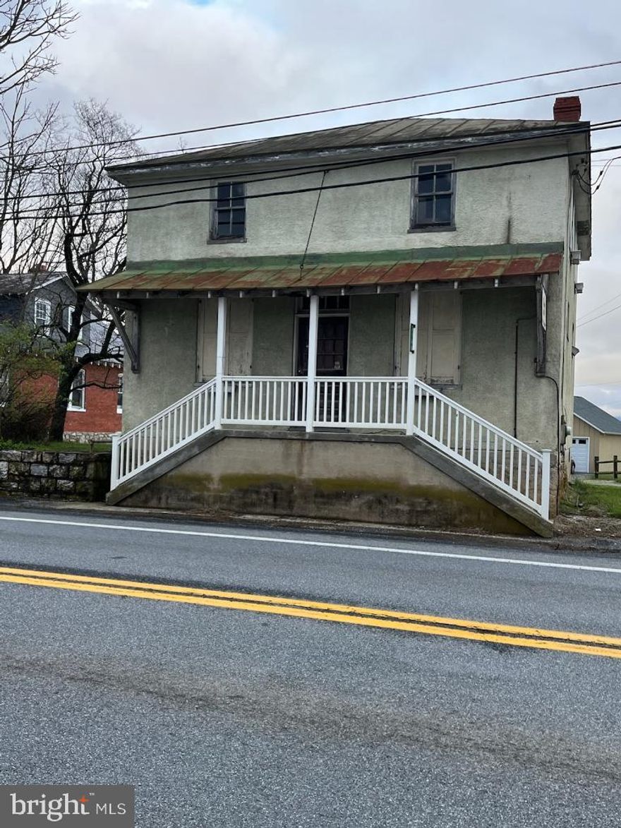 A unique property consisting of 2 buildings on 2 acres in the village of Rippon, WV, located midway between Charles town, WV and Berryville, Va       The brick Cape Cod style residence is ready for a complete remodel.  The stucco shop is a true gem.  Beautiful wood floors, ready to finish and vintage storage shelves and fixtures which convey.