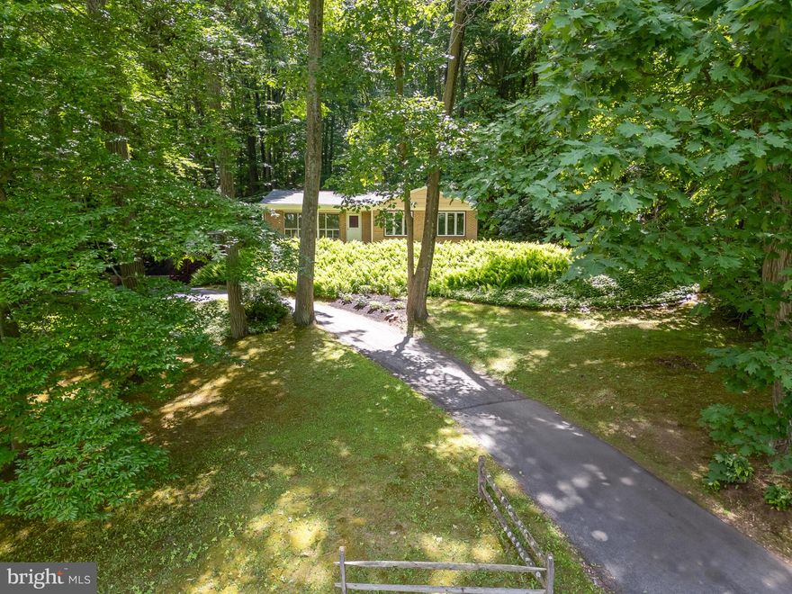 You can relax on your front porch or deck  enjoying  the lovely views  and watch the sun reflecting on the ferns in your front yard. This home has a wonderful unique setting.   Enter the home through the large  living room area  with a wall of windows that  provide great sun light and gives the home a mid century modern feel. The living room opens to a nice size dining room area connecting to the kitchen.  It has an outside entrance to the deck with steps leading to driveway. There is  a master bedroom with private bath, 2 additional bedrooms and the hall bath. There are hardwood floors in the Living Room, Dining Room, Hallway and all 3 bedrooms. The  ktichen and baths have tile. This home needs  TLC.  There is a full basement with laundry. Oversized driveway for off street parking and steps leading up to the deck  and around to the front door. Award winning Downingtown Area School District. Lots of potential! Home being sold 'As Is" .