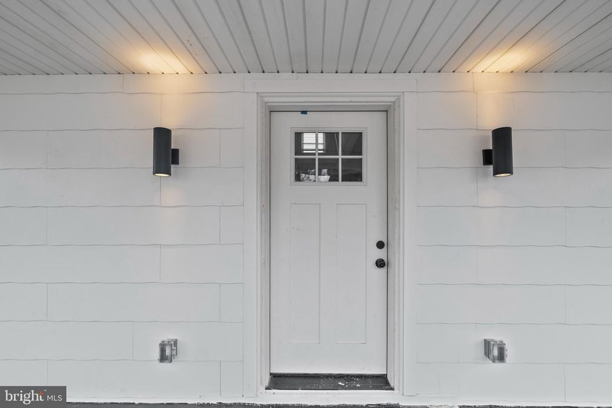 Welcome to this exquisite detached home in the heart of Gwynn Oak, MD, where southern charm harmoniously blends with modern sophistication. This fully renovated gem boasts 4 bedrooms and 2.5 bathrooms, offering an abundance of space and luxury for comfortable living. Step inside to discover a sprawling main level, featuring an expansive waterfall peninsula that anchors the gourmet chef's dream kitchen. Outfitted with top-of-the-line stainless steel appliances, including a gas range and over the counter microwave, this kitchen is designed for both functionality and style. The attention to detail is evident throughout, with recessed lighting and faux wood blinds adding a touch of elegance to every room. The living room features focal wall with electric fireplaces, creating a cozy and inviting atmosphere. The porch front is perfect for enjoying your morning coffee or evening gatherings, and a large semi-fenced-in backyard is ideal for outdoor activities and relaxation. The lower level offers a spacious recreation room, complete with a dry bar, a full bedroom & a full bath, providing a versatile space for guests or family. The upper level includes 3 bedrooms with an additional full bath, offering privacy and comfort. This home has undergone a top-to-bottom renovation, ensuring that every detail has been carefully considered. The exterior includes a multi-car driveway and a detached garage out back providing plenty of parking for residents and guests. Located close to all major routes, this home offers easy access to Charm City, making it a perfect choice for those seeking both convenience and luxury. Experience the epitome of suburban living with a touch of modern charm in this stunning Gwynn Oak residence.