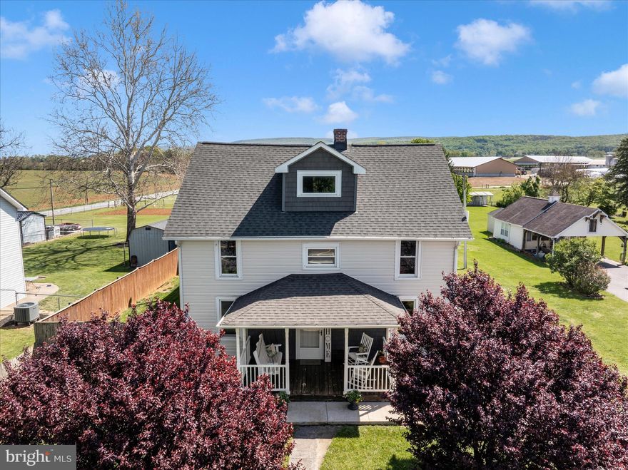 **Modern Elegance Meets Timeless Charm in Boonsboro**

Discover the perfect blend of historic character and contemporary luxury at 8031 Old National Pike. This stunning Colonial residence, originally built in 1935 and recently renovated, offers a rare opportunity to own a turnkey home on a generous half-acre lot in the heart of Washington County. The exterior has been completely transformed with brand new siding and a beautiful new Trex deck, perfect for low-maintenance outdoor living. With over 3,161 square feet of finished living space, this home is designed for both grand entertaining and cozy daily living. The traditional floor plan features a gourmet kitchen equipped with top-tier stainless steel appliances, including a smart electric range with double ovens, a built-in convection microwave, and exquisite brand new quartz countertops. Sophisticated details like hardwood floors, elegant crown moldings, and wainscoting flow throughout the main level, which also includes a convenient entry-level bedroom and full bathroom.

Relax by the wood-burning fireplace in the inviting family room or step outside to the level, cleared rear yard that provides the perfect canvas for summer gatherings, all while offering breathtaking mountain and valley views. For those with hobbies or storage needs, the property includes a detached oversized garage, a paved driveway for up to six vehicles, a versatile office/gym space, a chicken coop, and a wood/metal shed. Located in the vibrant Boonsboro community, you are just minutes away from local parks and highly-rated Washington County Public Schools. This home offers a balanced lifestyle—serene rural privacy without sacrificing accessibility to essential services.