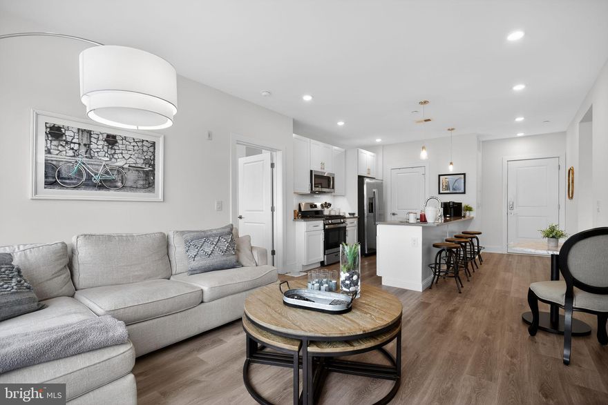 Garage parking in the heart of Northern Liberties at 1148 N. 2nd Street #4E, a bright and beautifully finished 2-bedroom, 2-bathroom residence in sought-after North Liberty Triangle.
Step into a sun-filled open-concept living and dining area that flows seamlessly into a modern gourmet kitchen featuring quartz countertops, soft-close cabinetry, stainless steel appliances, under-cabinet lighting, and a large island with seating—perfect for both everyday living and entertaining. Just off the living space, a private balcony overlooking Girard Ave offers the perfect spot for morning coffee or evening relaxation.
The primary suite provides a comfortable retreat with excellent natural light, a generous walk-in closet, and a well-appointed en-suite bathroom featuring a walk-in tiled shower with seamless glass doors and contemporary finishes.
A second bedroom, positioned on the opposite side of the home for added privacy, is ideal for guests, a home office, or additional living space and sits conveniently beside the second full bathroom.
Additional highlights include in-unit laundry, modern finishes throughout, and a parking space included.
North Liberty Triangle offers residents a secure lobby, private parking garage, fitness center, elevator, package room, trash chutes, and beautifully maintained common areas. The home also benefits from approximately 7 and a half years remaining on the 10-year tax abatement.
Ideally located in the heart of Northern Liberties, this home places you just steps from neighborhood favorites including cafés, restaurants, parks, and shopping—while offering easy access to Center City and major transit routes.