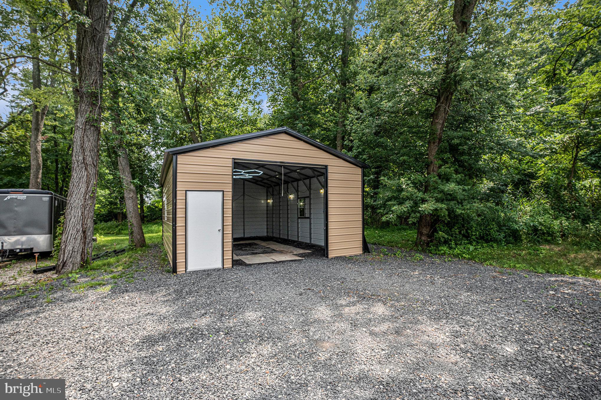 Large detached garage (Unit D) for lease. 20 x 32 with overhead door. This large building has excellent overhead lighting and separate door access. Perfect for storing larger vehicles. If you need office space for your business, look no further than Units A & B at the front building, both of which can be rented separately or combined. Water and Sewer are included in the rent for the office spaces. The owner will prorate the electric bill every six months for reimbursement. Unit C is currently rented until April 2026, but it can be considered for future expansion. Owner is receptive to renting individual units or packaging available units. Use-Matrix attached to see all the uses available in the Business Center Zoning District, as well as the Application for Zoning Use if interested in renting the space. Make an appointment today!