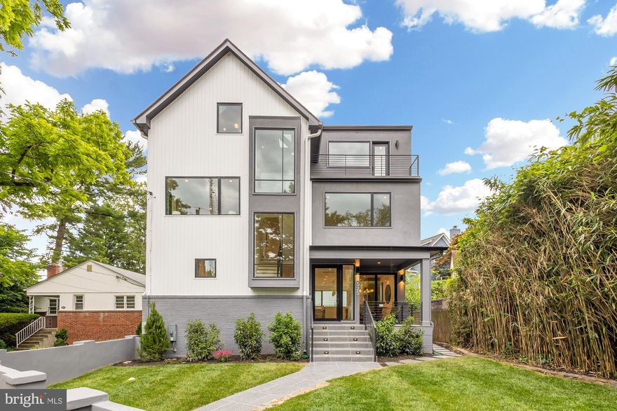 Introducing an exceptional and brand new, luxurious property, situated on an incredibly private, history-rich street only moments from all the conveniences Tenleytown has to offer. This stunning residence provides an unparalleled living experience, featuring exquisite design and meticulous attention to detail throughout. As you step into the main level, you are greeted by the grandeur of 9-foot ceilings, which create a sense of spaciousness and elegance. The open floor plan with Oak Wood Floors throughout seamlessly connects the main living spaces, allowing for effortless flow. The heart of the home is the open and airy kitchen, boasting Wood-Mode Fine Custom Cabinetry, top-of-the-line Thermador appliances, and a magnificent large waterfall island made from Calacatta Ultra quartz. Whether you're preparing a gourmet meal or hosting a gathering, this kitchen is sure to inspire and impress. The expansive main level is further enhanced by the large Pella Lifestyle Series windows and sliding doors, which not only invite the outdoors in but also illuminate the space with an abundance of natural light. The elongated Dimplex IgniteXL Built-in Linear Electric fireplace with fluted tile serves as a captivating focal point, adding warmth and sophistication to the living area. Additionally, a stylish powder bathroom and coat closet complete the main level. 

Ascend to the second floor, where the 9-foot ceilings continue to elevate the living experience. Two generously sized bedrooms with en-suite baths provide comfort and privacy. The primary bedroom suite is a true sanctuary, featuring a large ensuite bathroom with dual vanity sinks and wash closet as well as his and hers closets with custom systems, offering a well-organized and luxurious living space. The convenience of a laundry closet with Electrolux washer and dryer on this level adds a touch of ease to everyday living. The third floor presents a versatile space that can be tailored to suit your lifestyle. Whether it's a bonus family room for relaxation in the loft area or a home office, the top level offers endless possibilities with the two additional bedrooms with ensuite bathrooms and balconies. 

The lower level, offering a separate entrance, is designed to maximize comfort and functionality, featuring luxury Vinyl flooring and large windows that flood the recreational space with natural light. A well-appointed bedroom and full bathroom on this level provides a perfect retreat for guests or can be utilized as a private au pair suite. Ample storage and additional laundry further enhance the convenience and functionality of this charming home. Enjoy two private parking spaces for added convenience and security, ensuring ample parking for you and your guests. Additionally, the inclusion of an EV charging station reflects a commitment to sustainable living and modern convenience, allowing for seamless integration of eco-friendly transportation into your lifestyle. Don’t miss your opportunity to live in one of DC’s hottest neighborhoods! Conveniently offering a vibrant mix of dining, shopping, and entertainment options with convenient public transportation and nearby parks, providing a balanced urban living experience.