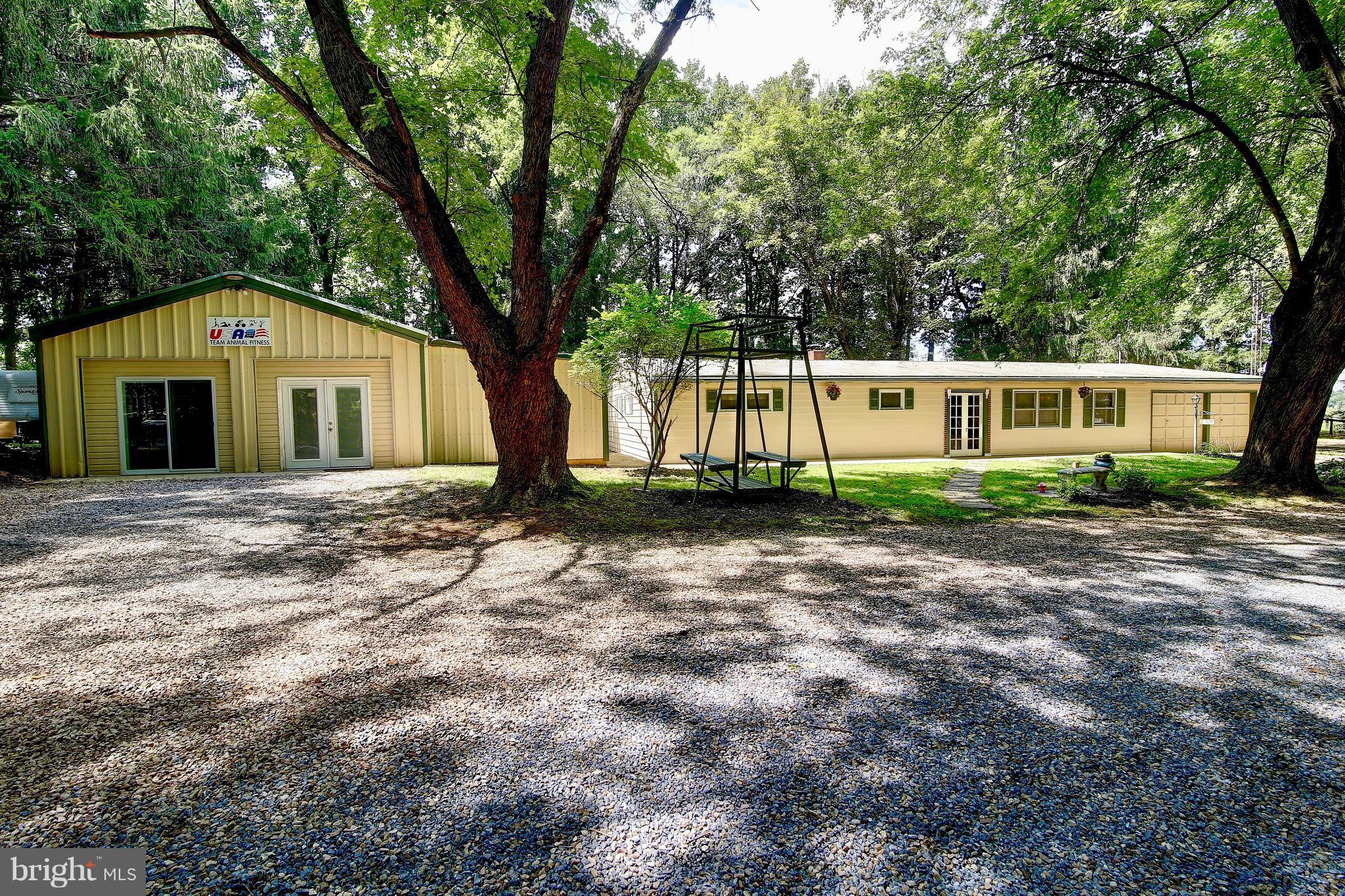 Rare find - one level living on 5 picturesque acres with detached 40x40 steel framed workshop, fully equipped with heating/cooling/electric/plumbing. Unrestricted farmette - bring your horses or any farm animal. 3-board fencing w/paddocks with run-in shed, storage shed, tree lined pea gravel driveway. Remodeled kitchen, bright sunroom overlooking yard. Beautiful pastoral views; Boonsboro schools.