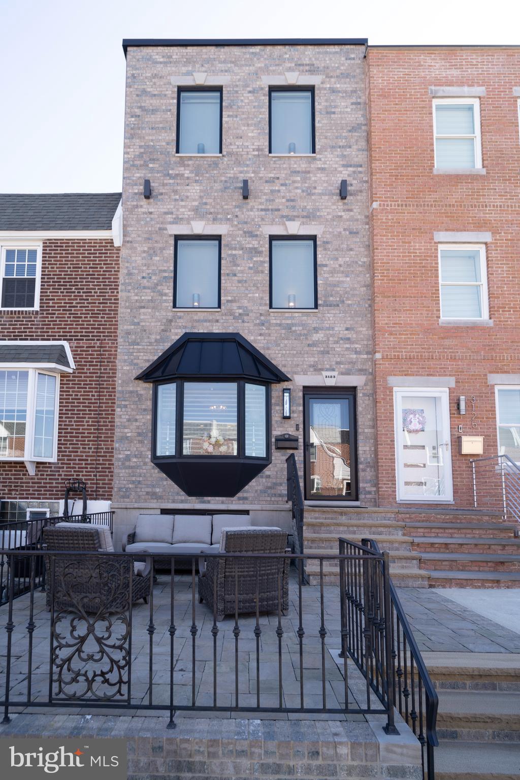 Stunning Fully Renovated Home in Packer Park East South Phila Stadium District!!! Welcome to your dream home. Fully renovated with permits plans and approvals this stunning home showcases a seamless blend of modern luxury and timeless charm. Featuring a newly added third floor, roof deck and private parking !!! finished lower level set up for home Gym,office space or additional living area amentities fireplace and a powder room!! 1st level chefs Kitchen with Omega Cabinets solid wood /, quartz countertops stainless steel appliances!! Custom moldings through out hardwood floors and marble tiles add to this beautiful setting!! three outdoor seating areas with private roof deck with panoramic city views complete with wet bar for entertaining also front patio and rear deck on first floor!!! Dual zone heating and A/C providing custom climate control for different areas of this beautiful home rear one car parking under deck. come and check out this lovely home!!!