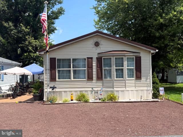 REDUCED!! This is it! Your new cottage beach pad!! Located in the water oriented, boater friendly, amenity rich community of White Horse Park 12 minutes to Ocean City beaches!! This is a deeded lot with no ground rent. You will not find anything in the area this great at this price point. This home features 2 bedrooms, a full bath with tub and shower, full kitchen with gas stove/range, fridge with ice maker, built in microwave and full-sized dining set. There is also a stack washer and dryer, and central air!! Nice open living area with a 50-inch TV included. Outside is a huge patio area, great for cook outs, listening to music, cooking crabs or just relaxing! Parking for 4 cars in the front!! Brand new metal roof just put on last year too! White horse Park community features many amenities including a huge community pool, waterfront marina with a boat ramp and and 70 boat slips, boat storage yard, playground, basketball court, kayak storage racks, 2 bath houses with full sized laundry, and a free bike loaner program great for the kids! This is too good to be true and you better hurry! This is a private gated community with 24-hour security! Just minutes to the beach, Casino. shopping, dining and Assateague Island Seashore!! If you're looking for a beach home that won't break the bank, well this is it. Call now for your private showing today!!
