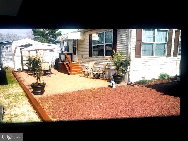 This is it! Your new cottage beach pad!! Located in the water oriented, boater friendly, amenity rich community of White Horse Park 12 minutes to Ocean City beaches!! This is a deeded lot with no ground rent. You will not find anything in the area this great at this price point. This home features 2 bedrooms, a full bath with tub and shower, full kitchen with gas stove/range, fridge with ice maker, built in microwave and full-sized dining set. There is also a stack washer and dryer, and central air!! Nice open living area with a 50-inch TV included. Outside is a huge patio area, great for cook outs, listening to music, cooking crabs or just relaxing! Parking for 4 cars in the front!! Brand new metal roof just put on last year too! White horse Park community features many amenities including a huge community pool, waterfront marina with a boat ramp and and 70 boat slips, boat storage yard, playground, basketball court, kayak storage racks, 2 bath houses with full sized laundry, and a free bike loaner program great for the kids! This is too good to be true and you better hurry! This is a private gated community with 24-hour security! Just minutes to the beach, Casino. shopping, dining and Assateague Island Seashore!! If you're looking for a beach home that won't break the bank, well this is it. Call now for your private showing today!!