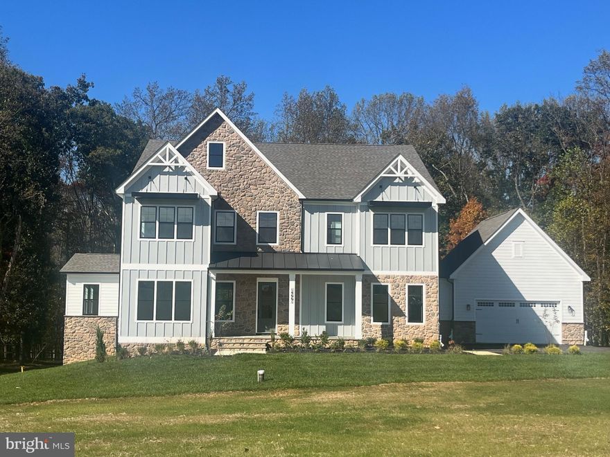 QUICK MOVE IN!! Ask About our financing incentives! Meet the Hampton II which includes 6 bedrooms/6.5 baths with a 4-car garage and sits on a very private 1.89 acre homesite and backs to conservation area. Enter this home from a covered porch and view the soaring 2-story foyer. A flex room with French doors greets the entrance for use as you prefer- a home office or formal living room. The formal dining room is off the foyer and includes tray ceilings. Tray ceilings are additionally included in the family room and kitchen area. The kitchen and great room share the ever-desired open concept feel. Stay cozy near the contemporary linear fireplace and enjoy picturesque views from the double sliding glass doors. A conservatory is just off the family room. - perfect for holiday entertaining. The kitchen is complete with Aristokraft soft-close cabinets with below cabinet lighting and quartz counters. Fit for a chef this kitchen includes high-end KitchenAid gourmet appliances with a 36” gas cooktop, double oven or microwave/oven combo, double oven, dishwasher and French door refrigerator. 10 Foot ceilings are throughout the main level with 9-foot doors giving a airy feel throughout. The owner entry is positioned nearby and includes a drop zone. A private first floor bedroom is tucked away with walk-in closet as well as a main level full bath with walk-in shower. The solarium is off the family room providing gorgeous, wooded views. Oak stairs with iron balustrade led to the bedroom level. The primary is at the top of the staircase and is finished with a bedroom and sitting area with tray ceilings. Enter the primary bath through a generous hall through French doors. This bathroom will take your breath away! A walk-through glass front shower is the focus of this bath with double shower heads and a free-standing tub in front. Separate vanities provide plenty of storage with soft-close cabinets and quartz counter tops. A water closet is off to the side. Two generous walk-in closets are in this bedroom. Mohawk Revwood floors are featured in the hallway. For convenience, the laundry room is on the bedroom level which includes cabinets and a utility sink. Storage is abundant with two linen closets. All secondary bedrooms are generously sized and include a bath and walk-in closet. Secondary baths finished with 6x6 ceramic tile, soft-close cabinets and quartz counters. The basement is complete with a recreation room, full bath and basement bar. A video doorbell, Echo Dot, Zwave thermostat and door lock and wi-fi enabled garage door openers. *Photos not of actual home, and are of a similar model*