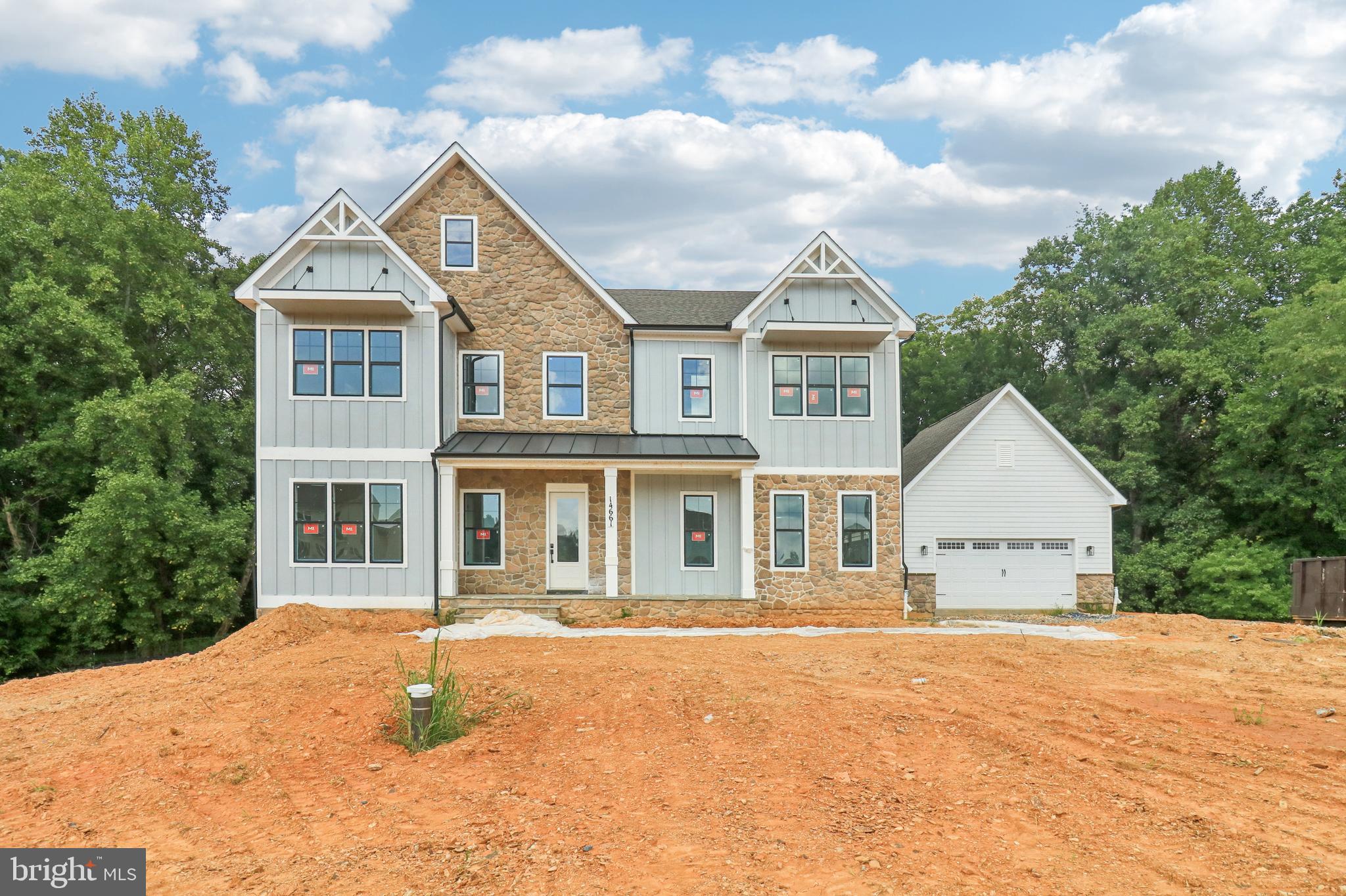 September 2025 MOVE IN!! Ask Abount our financing incentives! Meet the Hampton II which includes 6 bedrooms/6.5 baths with a 4-car garage and sits on a very private 1.5 acre homesite and backs to conservation area. Enter this home from a covered porch and view the soaring 2-story foyer. A flex room with French doors greets the entrance for use as you prefer- a home office or formal living room. The formal dining room is off the foyer and includes tray ceilings. Tray ceilings are additionally included in the family room and kitchen area. The kitchen and great room share the ever-desired open concept feel. Stay cozy near the contemporary linear fireplace and enjoy picturesque views from the double sliding glass doors. A conservatory is just off the family room. - perfect for holiday entertaining. The kitchen is complete with Aristokraft soft-close cabinets with below cabinet lighting and quartz counters. Fit for a chef this kitchen includes high-end KitchenAid gourmet appliances with a 36” gas cooktop, double oven or microwave/oven combo, double oven, dishwasher and French door refrigerator. 10 Foot ceilings are throughout the main level with 9-foot doors giving a airy feel throughout. The owner entry is positioned nearby and includes a drop zone. A private first floor bedroom is tucked away with walk-in closet as well as a main level full bath with walk-in shower. The solarium is off the family room providing gorgeous, wooded views. Oak stairs with iron balustrade led to the bedroom level. The primary is at the top of the staircase and is finished with a bedroom and sitting area with tray ceilings. Enter the primary bath through a generous hall through French doors. This bathroom will take your breath away! A walk-through glass front shower is the focus of this bath with double shower heads and a free-standing tub in front. Separate vanities provide plenty of storage with soft-close cabinets and quartz counter tops. A water closet is off to the side. Two generous walk-in closets are in this bedroom. Mohawk Revwood floors are featured in the hallway. For convenience, the laundry room is on the bedroom level which includes cabinets and a utility sink. Storage is abundant with two linen closets. All secondary bedrooms are generously sized and include a bath and walk-in closet. Secondary baths finished with 6x6 ceramic tile, soft-close cabinets and quartz counters. The basement is complete with a recreation room, full bath and basement bar. A video doorbell, Echo Dot, Zwave thermostat and door lock and wi-fi enabled garage door openers. July 2025 closing. *Photos not of actual home, and are of a similar model*
